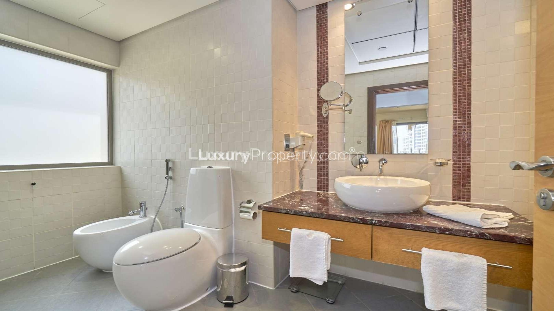 Modern kitchen in 3-bedroom apartment, Jumeirah Beach Residence, Murjan. Marble countertops, stainless appliances