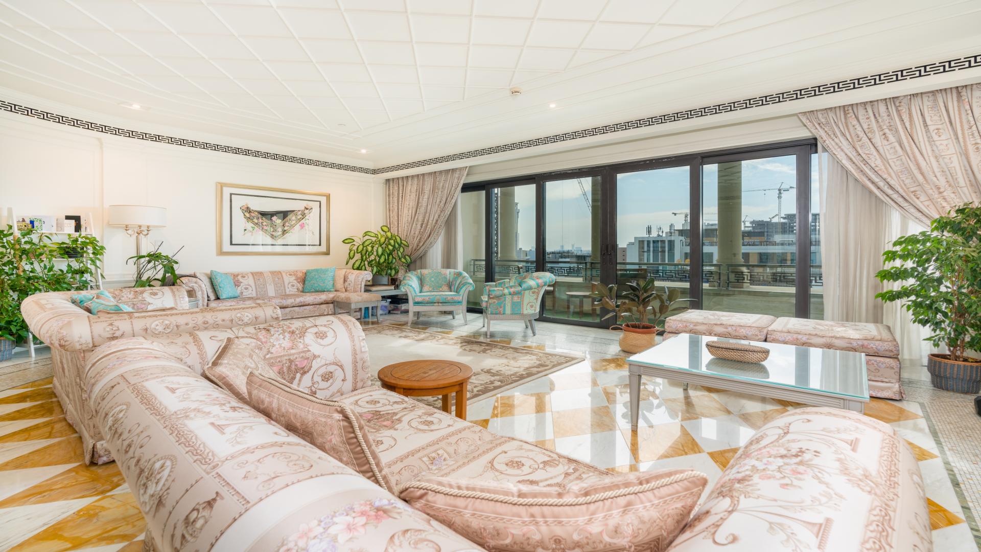 Luxurious dining room in Palazzo Versace apartment, Culture Village; elegant chandelier and decor
