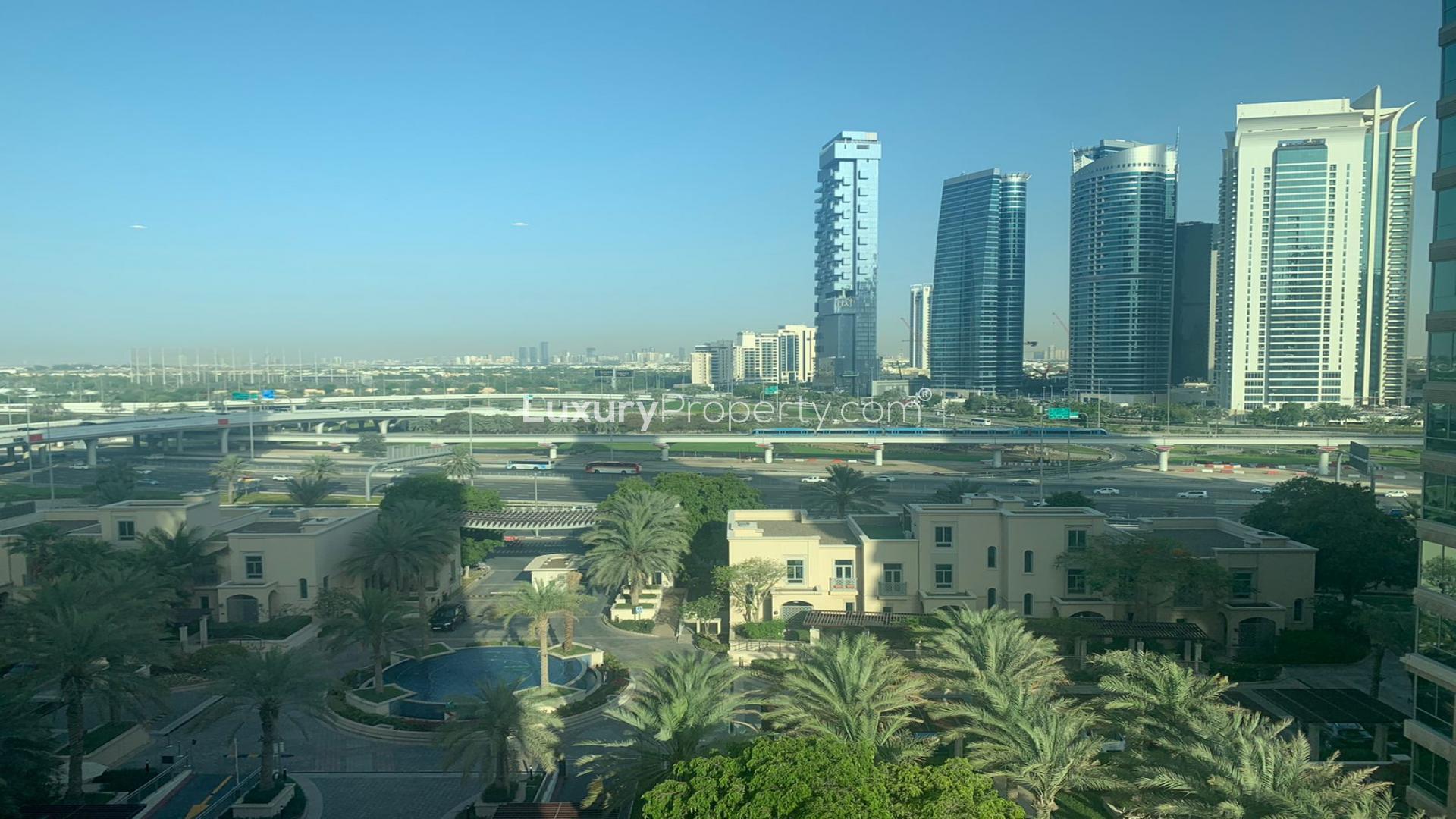 Modern kitchen in 3-bedroom apartment, Al Anbar Tower, Dubai Marina, with wooden cabinets and appliances