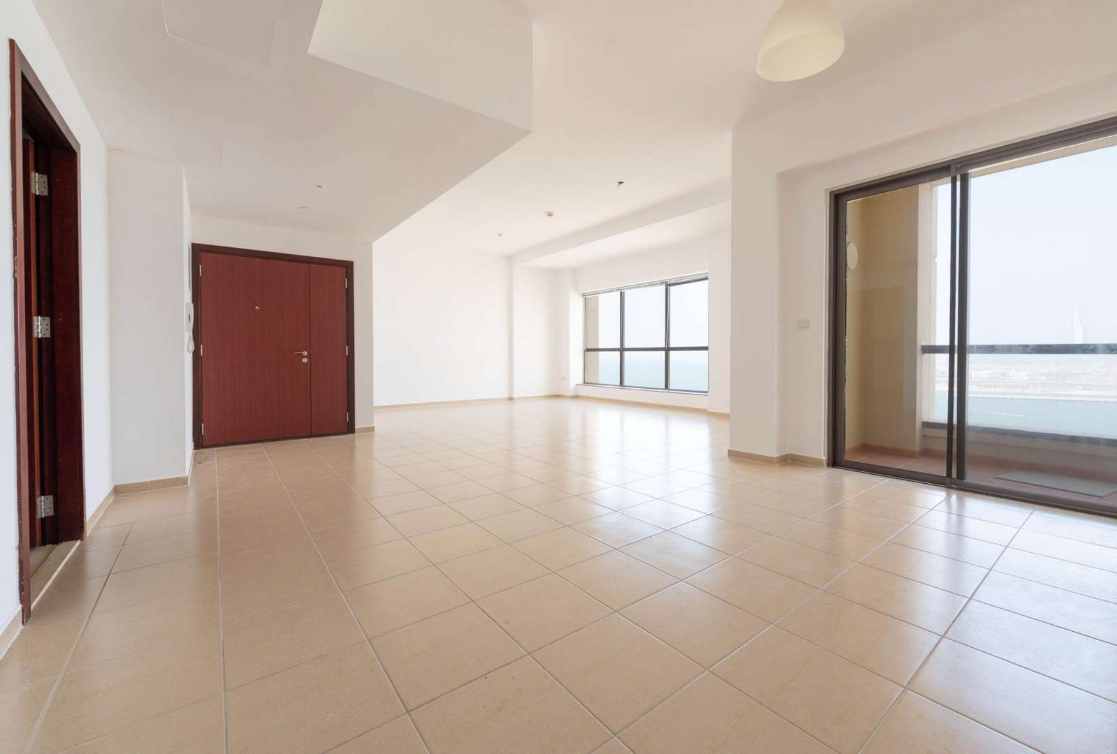 Empty living area in 3-bedroom JBR apartment for rent, Rimal, Dubai