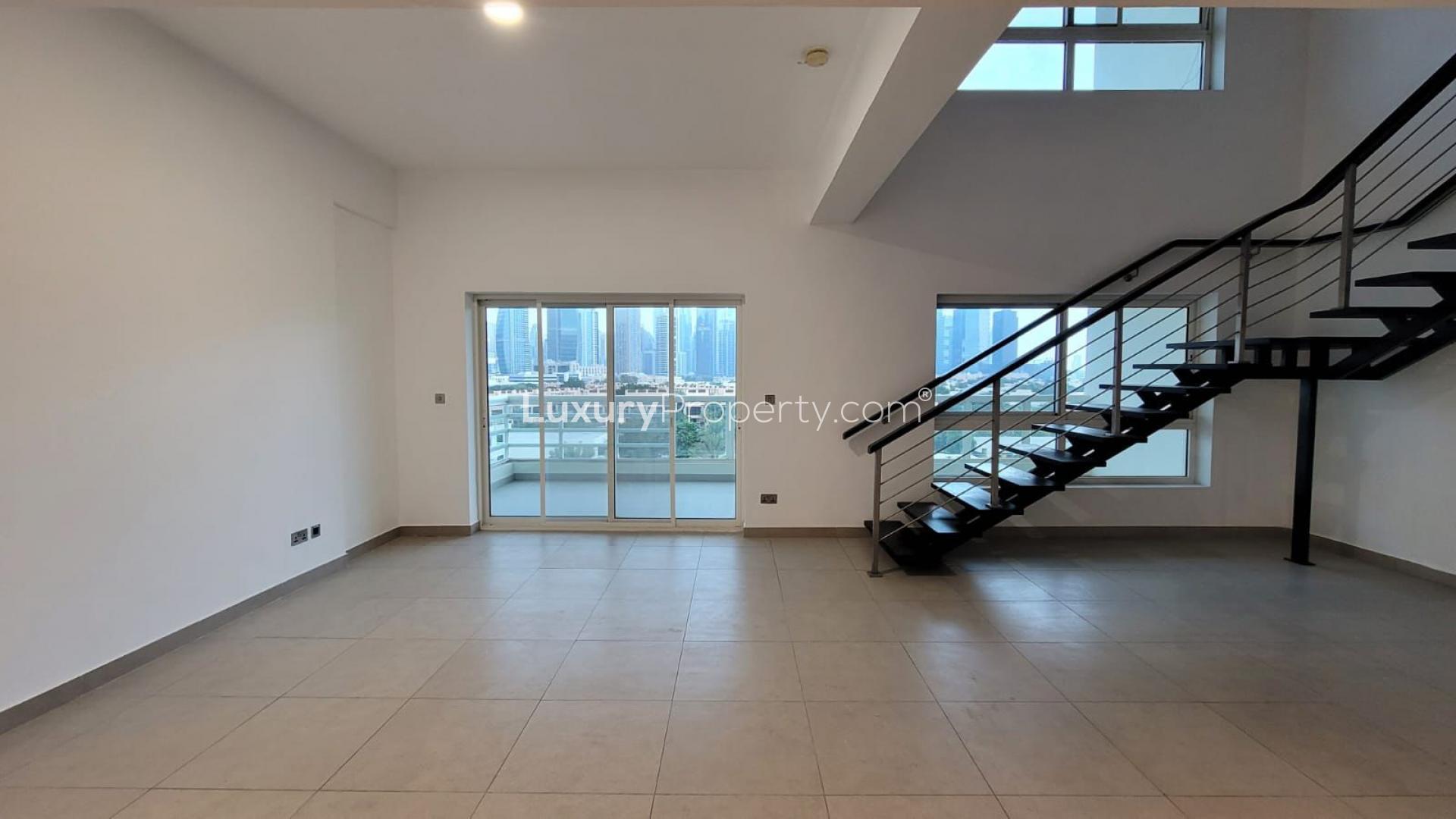 Modern kitchen in 3-bed duplex, Jumeirah Heights Cluster E, with granite countertops and appliances