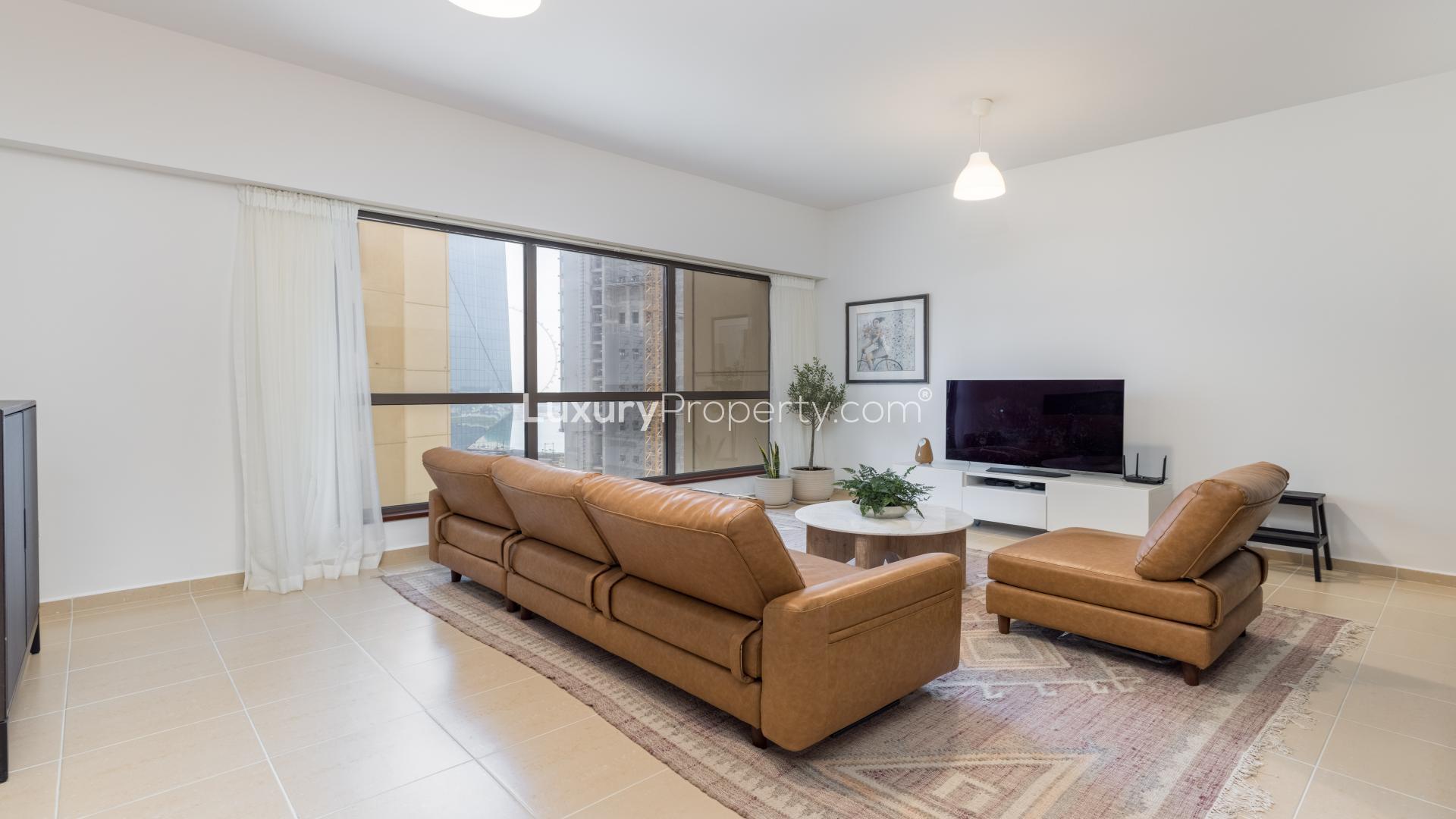 Dining and living area in JBR apartment, Sadaf community, modern decor, natural light
