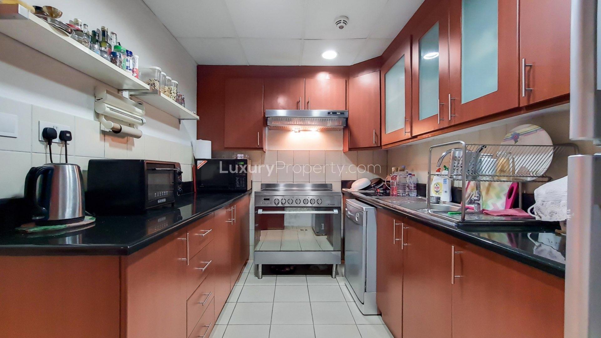 Open-plan living area in Jumeirah Beach Residence apartment with partial sea view