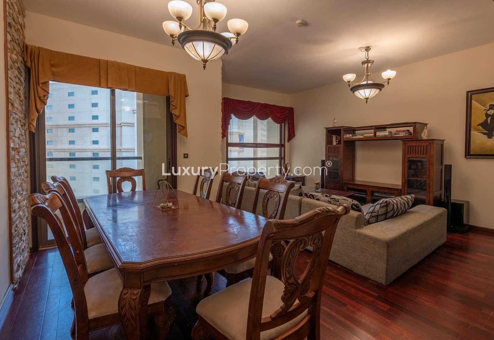 Furnished living room and dining area in Jumeirah Beach Residence apartment for rent