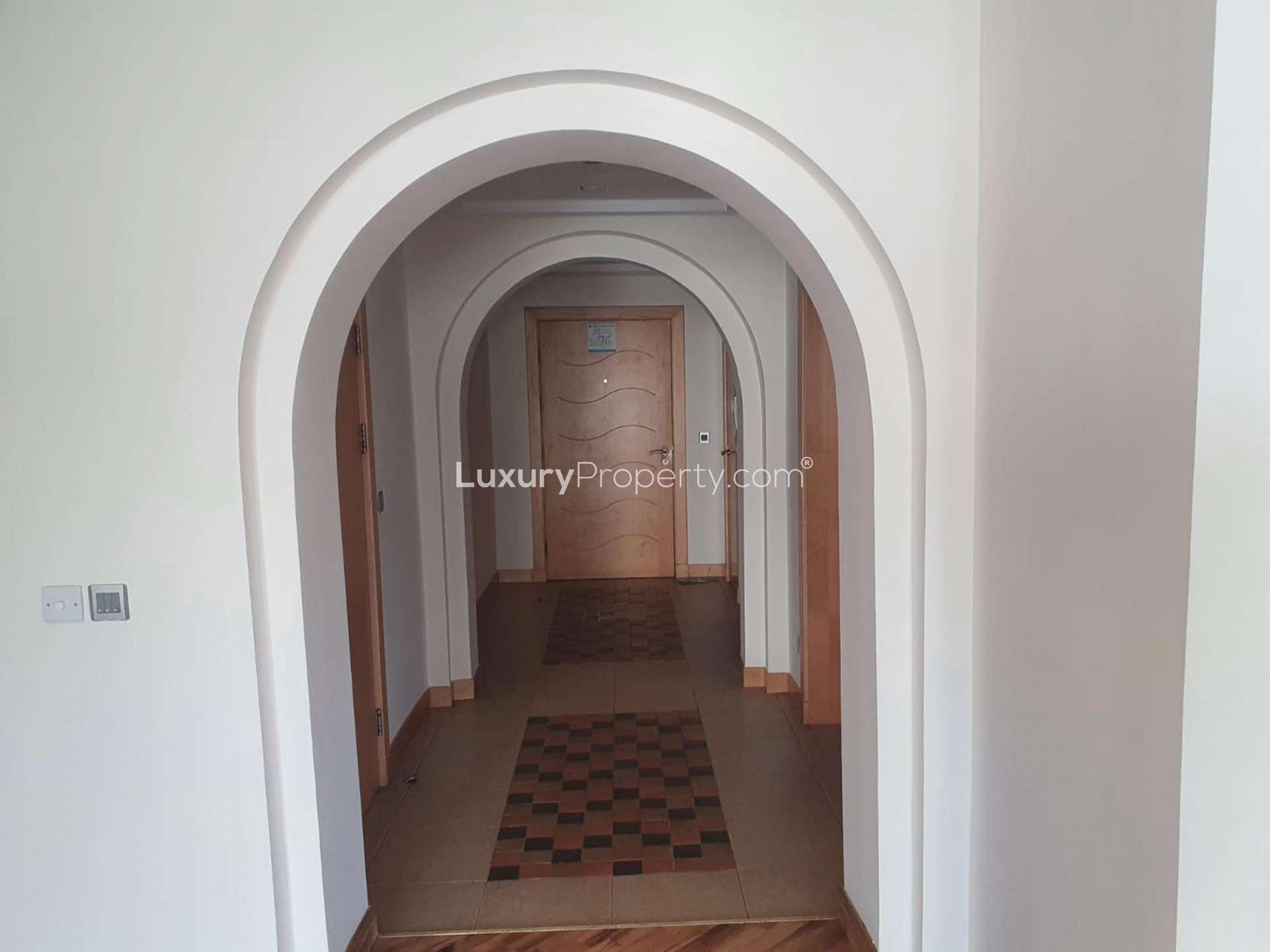Exterior view of Shoreline Apartments, Palm Jumeirah, showcasing residential buildings and sea backdrop