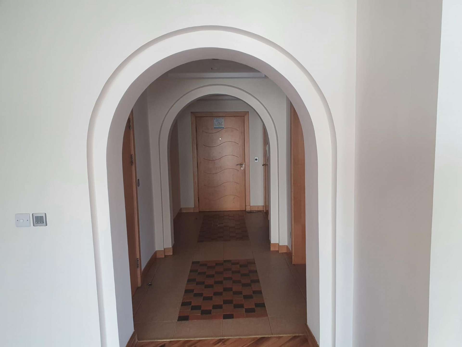 Exterior view of Shoreline Apartments, Palm Jumeirah, showcasing residential buildings and sea backdrop