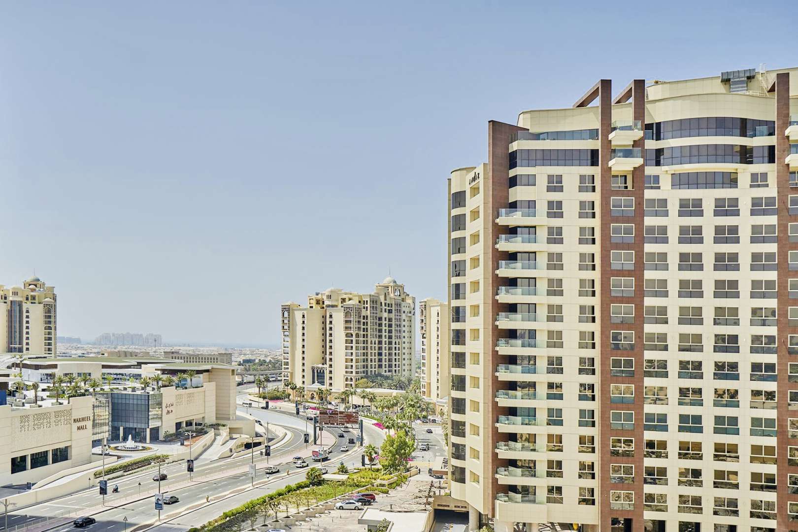 "Spacious bedroom in 3-bed Shoreline apartment, Palm Jumeirah. Modern decor with natural light.",Shoreline Apartments exterior, Palm Jumeirah view, near Nakheel Mall, perfect family rental