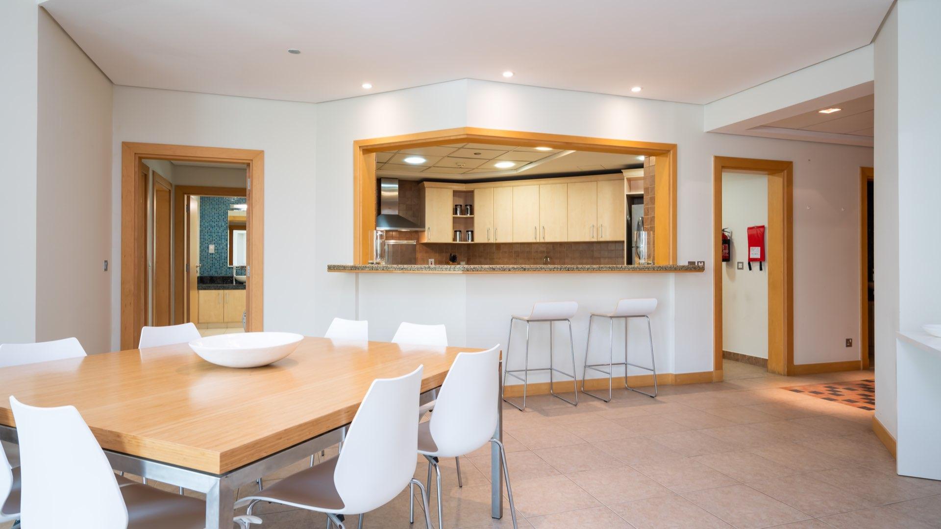 Furnished dining and living area in three-bedroom Shoreline apartment, Palm Jumeirah for rent