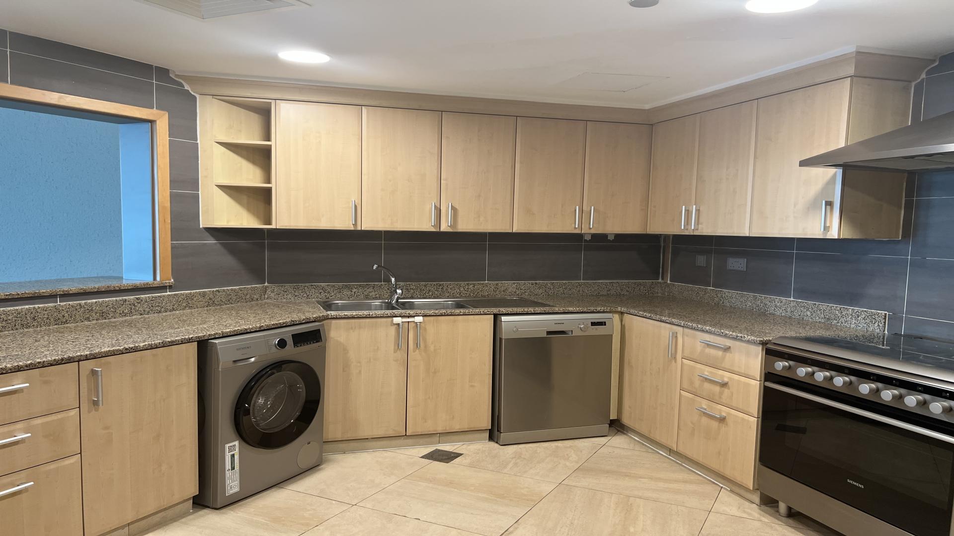 Modern living area in Palm Jumeirah Shoreline Apartment, featuring open layout and sleek finishes