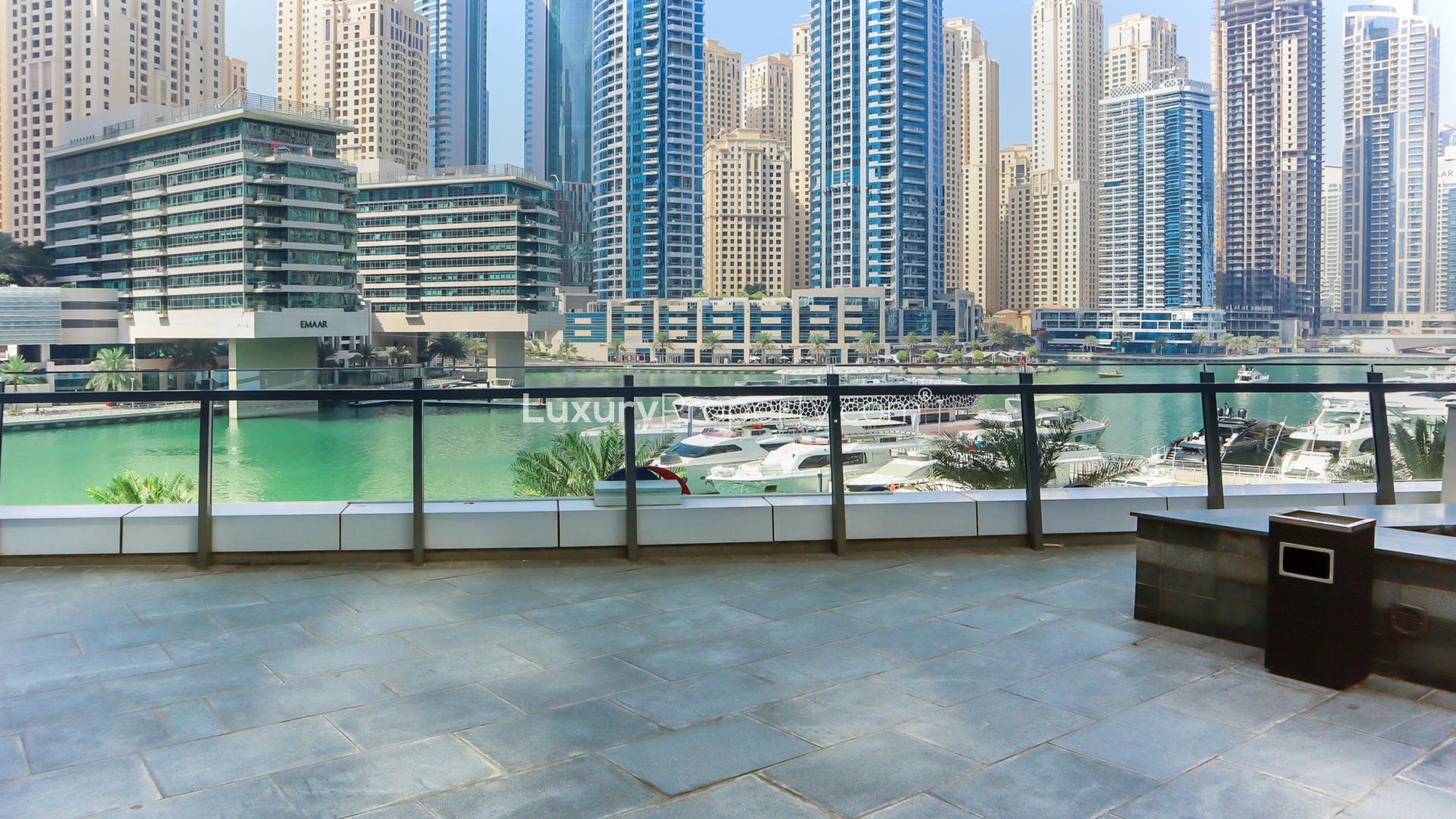 "Bright apartment interior with marina views from balcony, Silverene Towers, Dubai Marina.",Spacious balcony with stunning marina views from Silverene Towers apartment, Dubai Marina