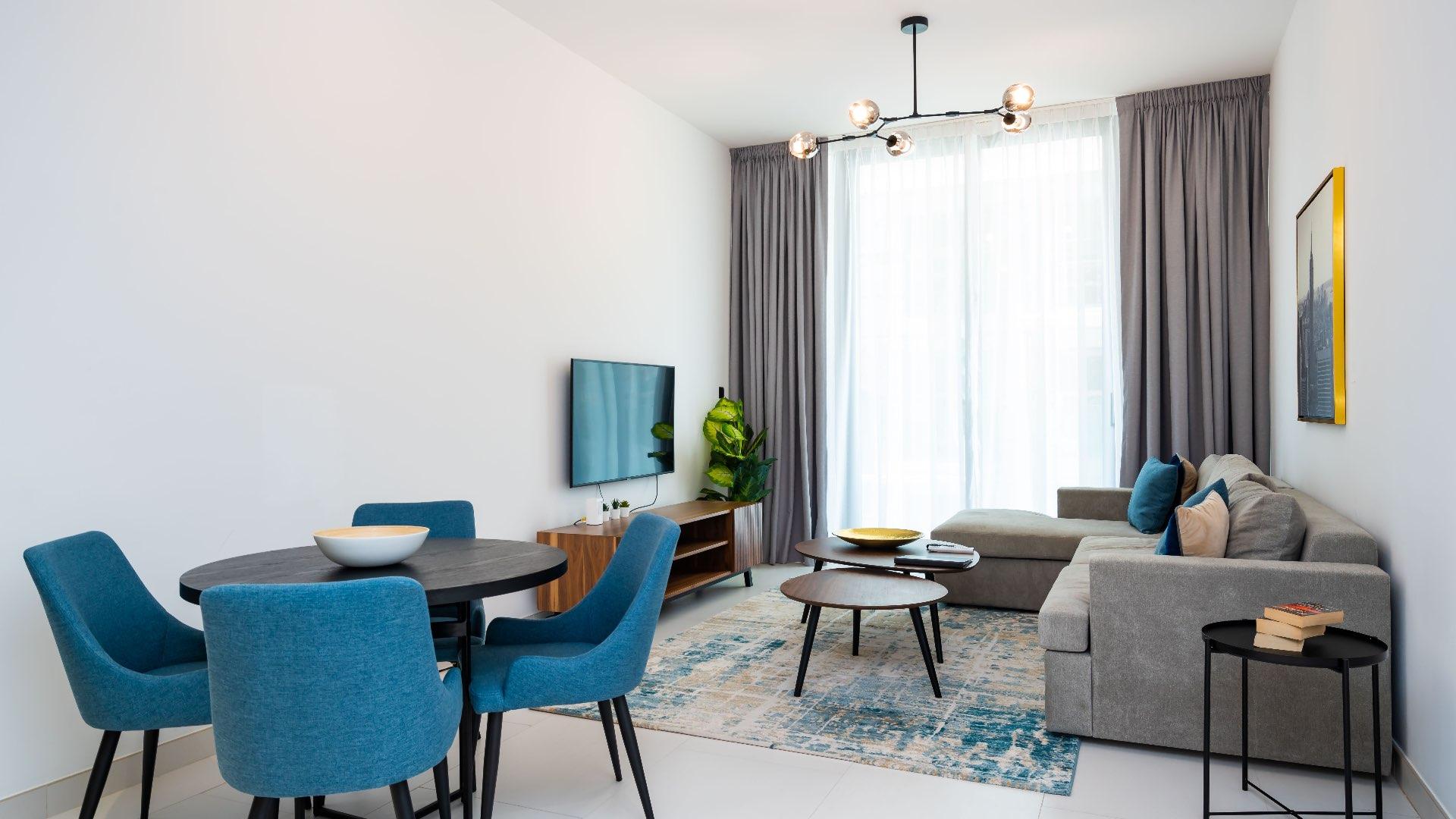 Luxurious living room in Palm Jumeirah apartment with modern decor and large windows