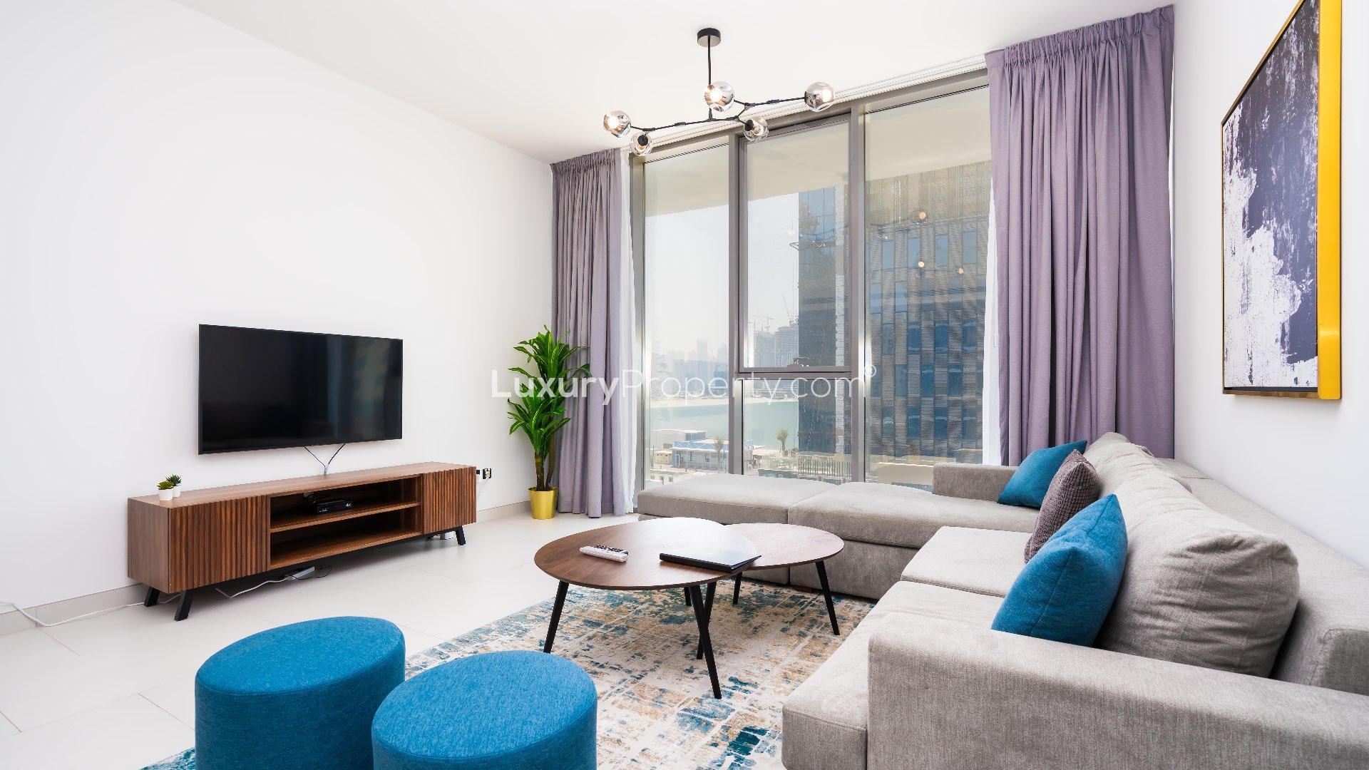 Luxurious Palm Jumeirah apartment terrace with sea view, modern seating, and umbrellas