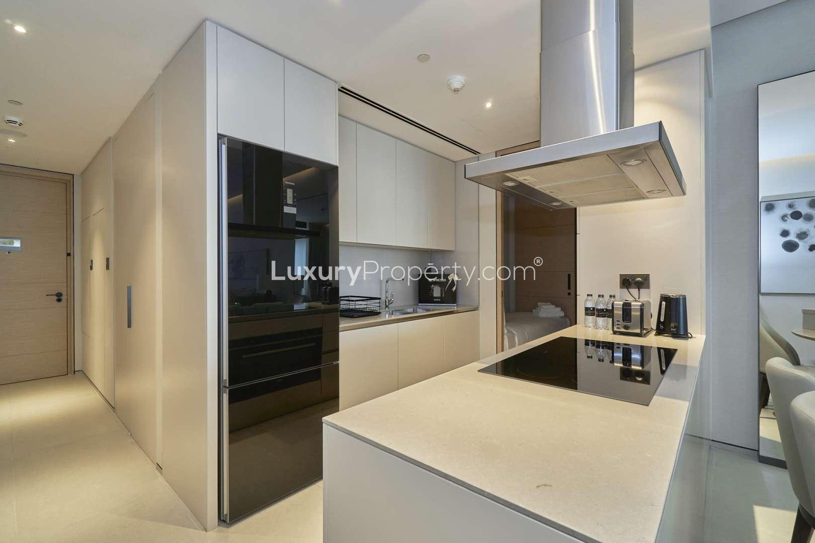 Modern living room in Juniper, Damac Hills 2 villa with park and pool view