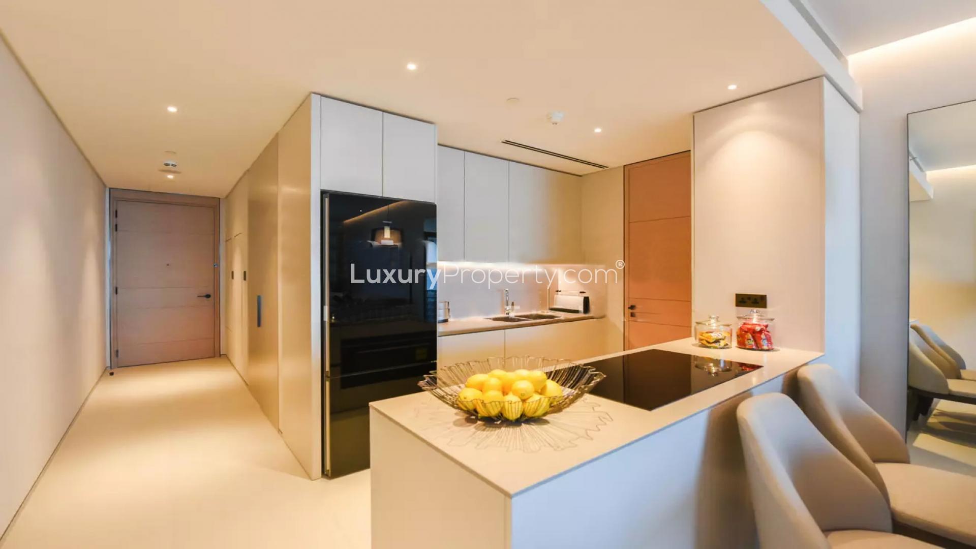Luxuriously furnished beachfront apartment kitchen and living area at Jumeirah Beach Residence