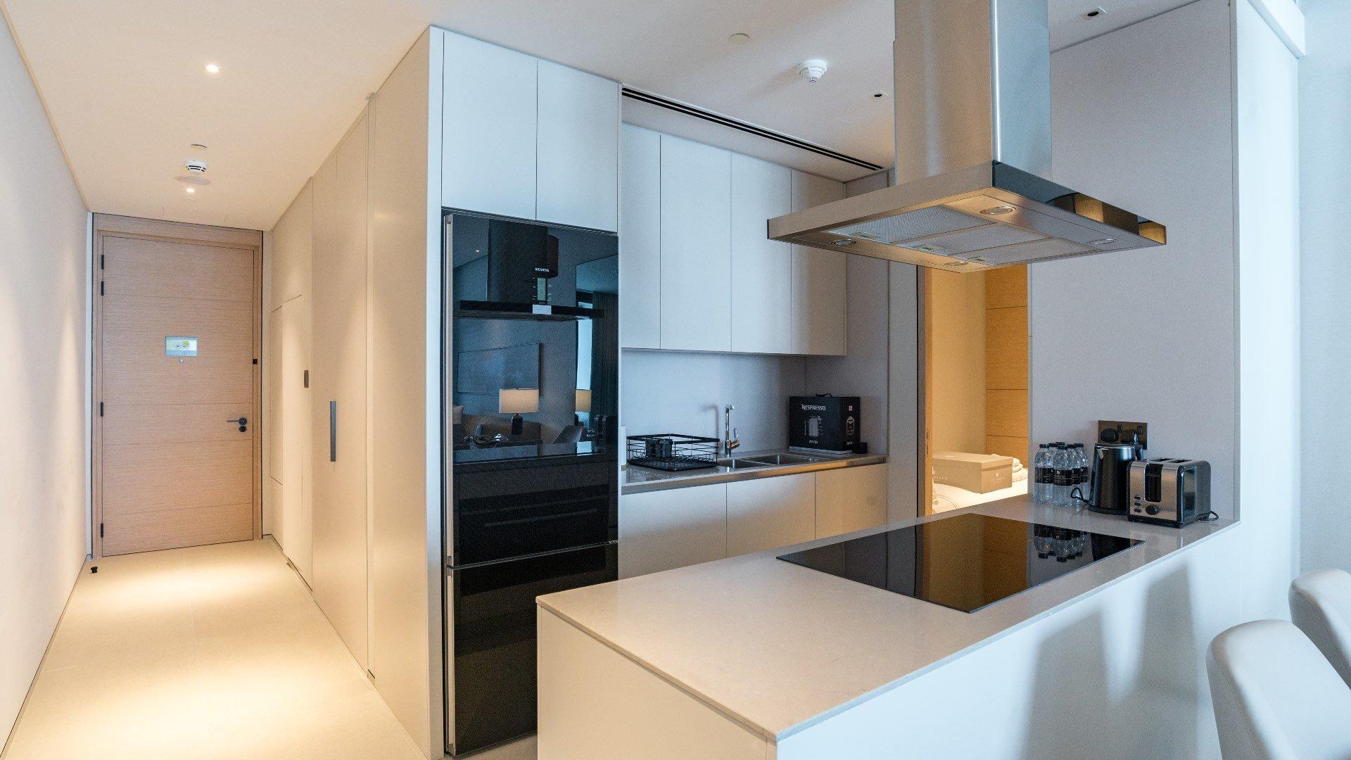 Furnished living room in Jumeirah Beach Residence apartment with modern decor and ample seating