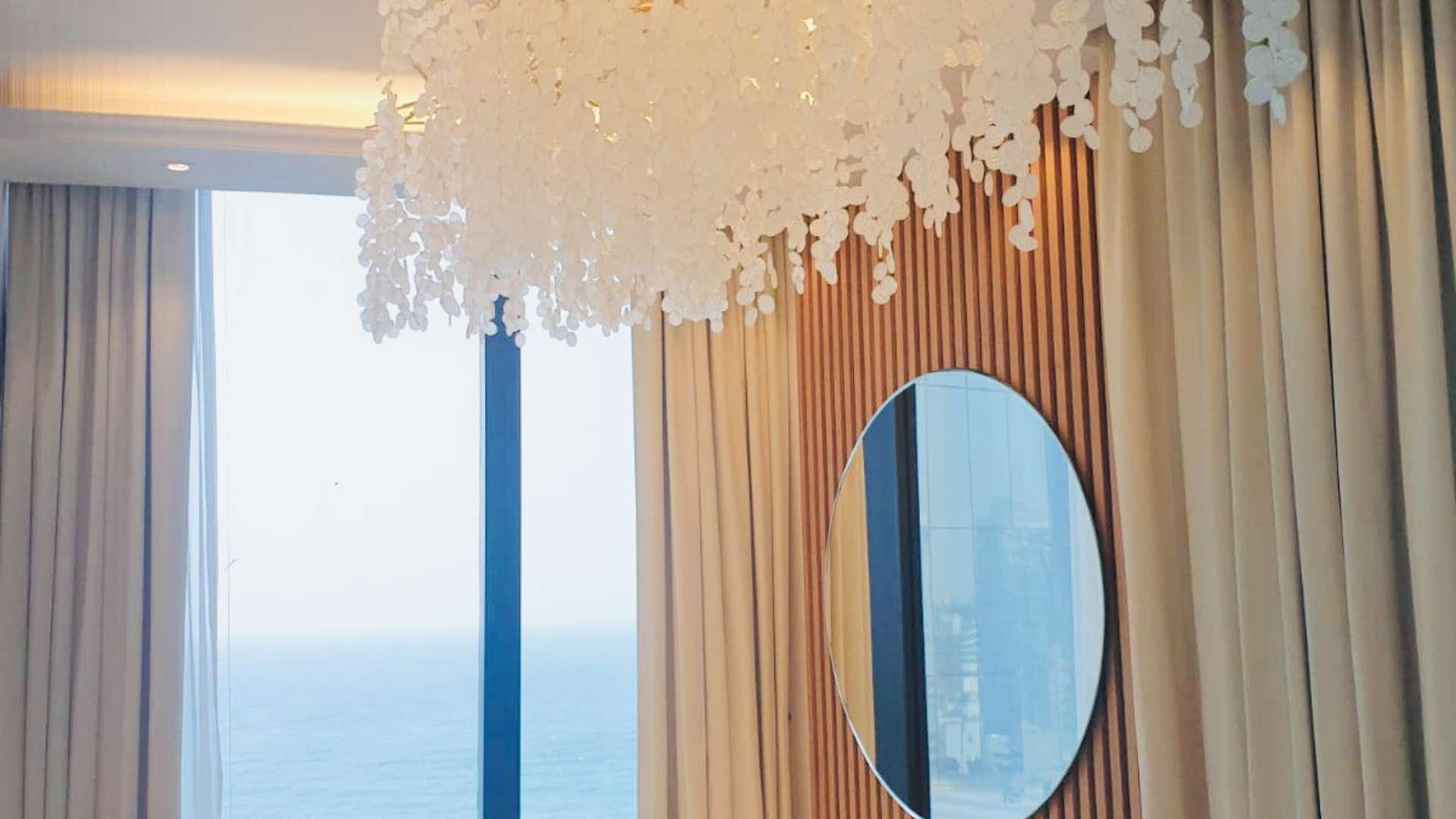 Luxurious interior of 3-bedroom apartment in Address Beach Resort, Dubai with ocean view