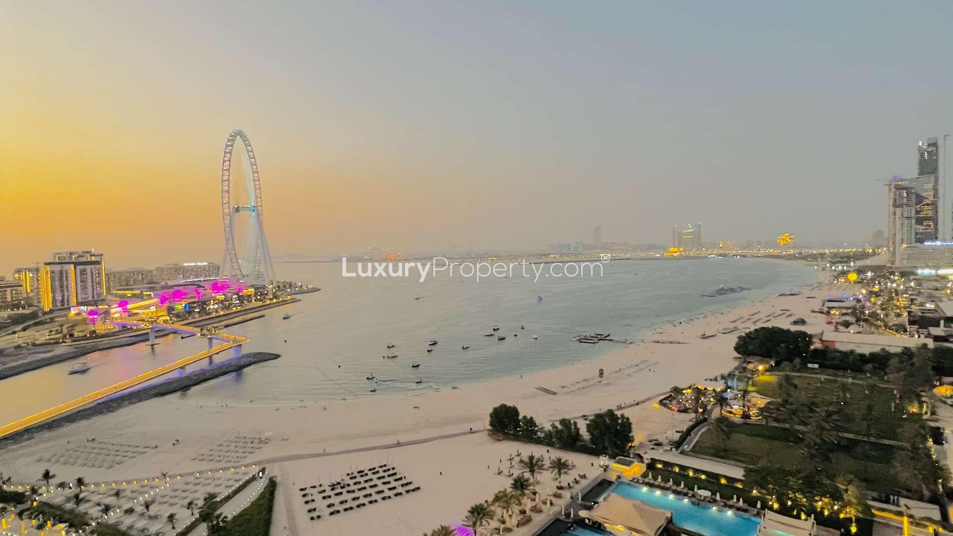 Furnished living room in Jumeirah Beach Residence apartment with modern decor and sea view