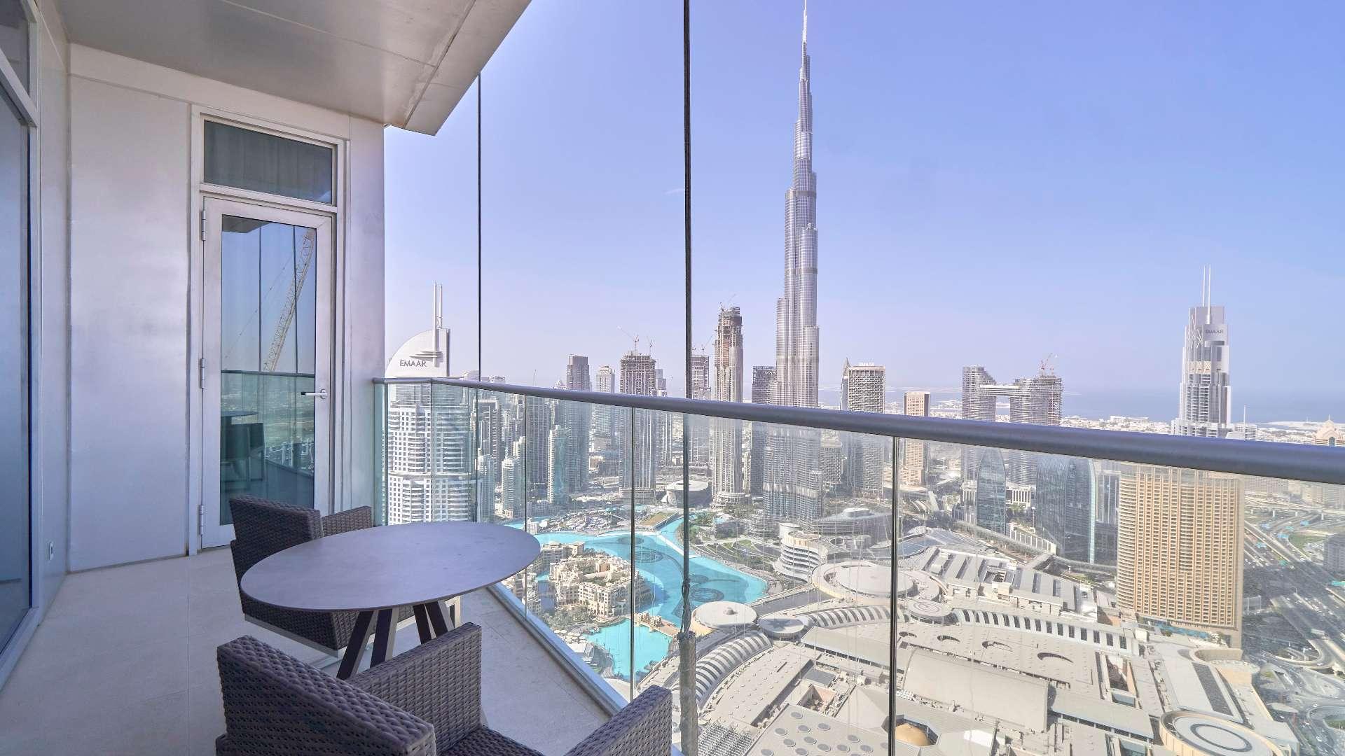 Luxurious living room in Downtown Dubai apartment with modern furniture and city views