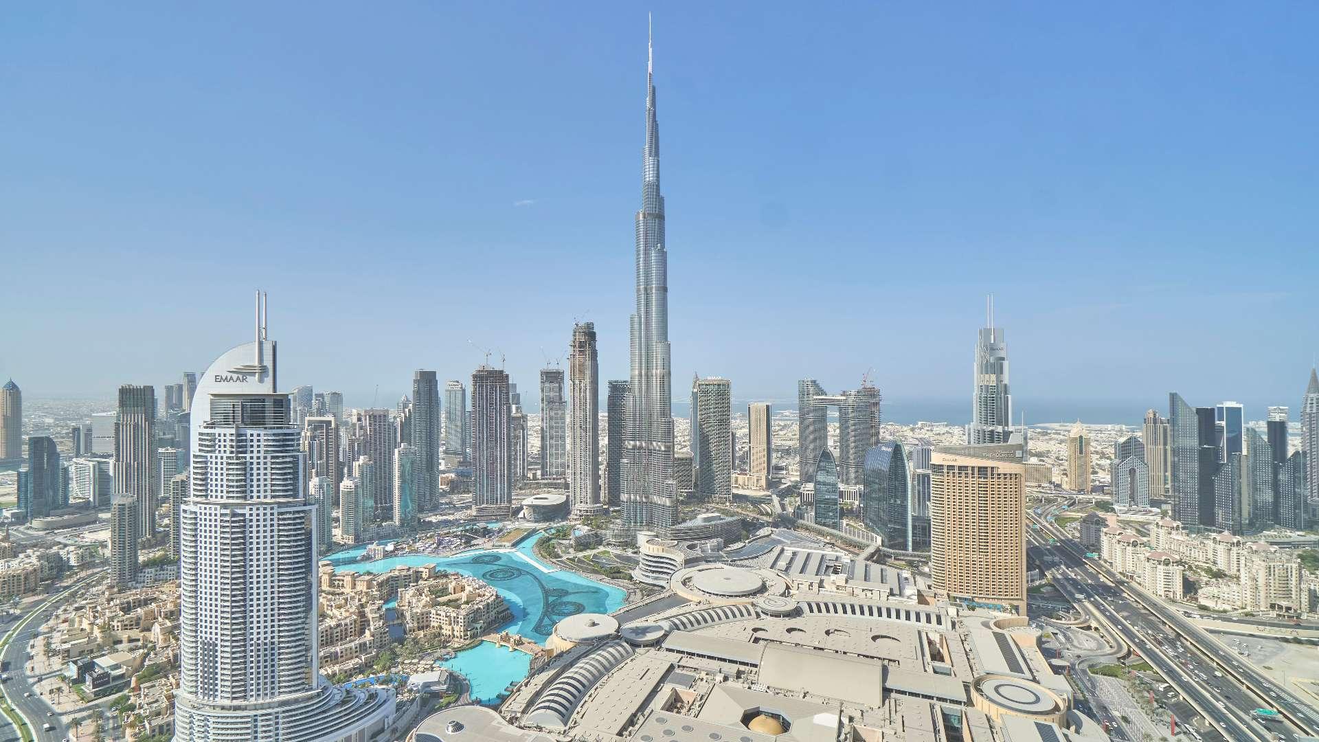 Balcony view from luxury apartment in Downtown Dubai overlooking city skyline and Burj Khalifa
