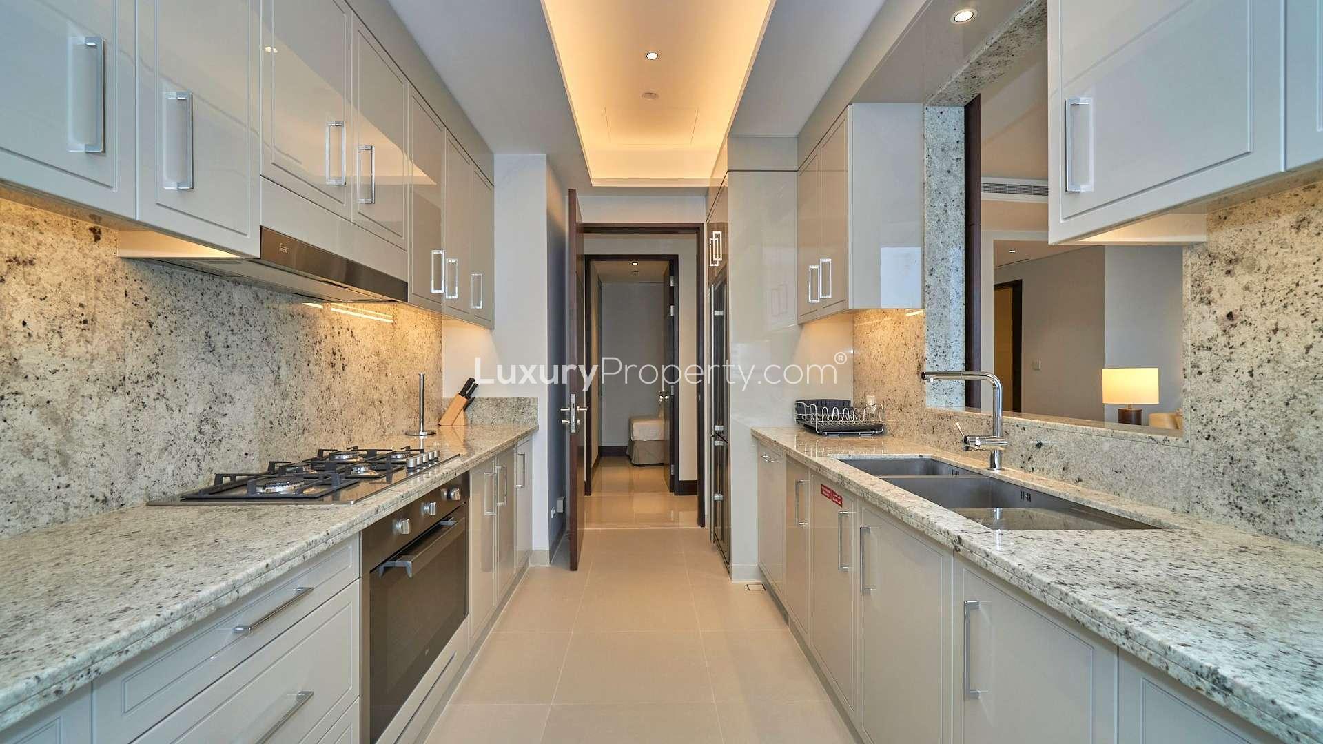 Modern kitchen with granite countertops and sea view in Downtown Dubai apartment for rent
