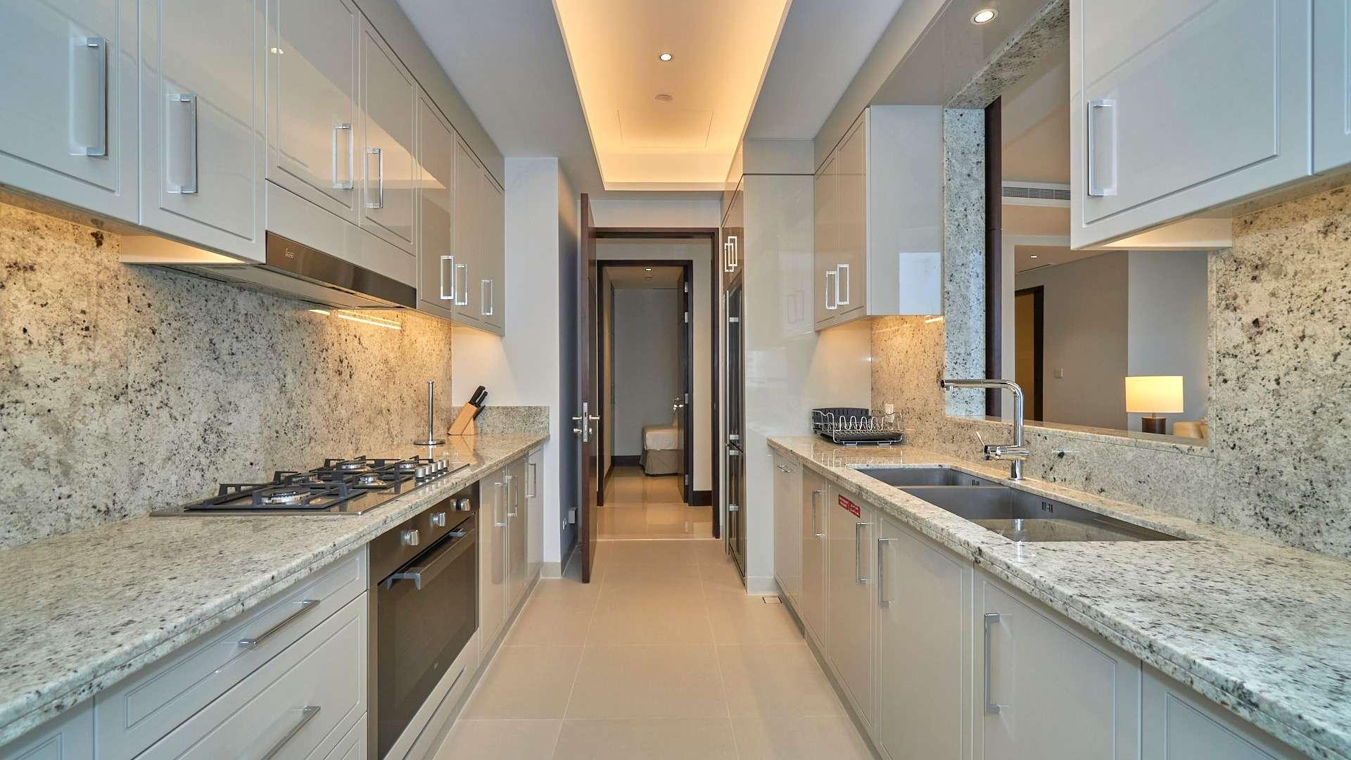 Modern kitchen with granite countertops and sea view in Downtown Dubai apartment for rent
