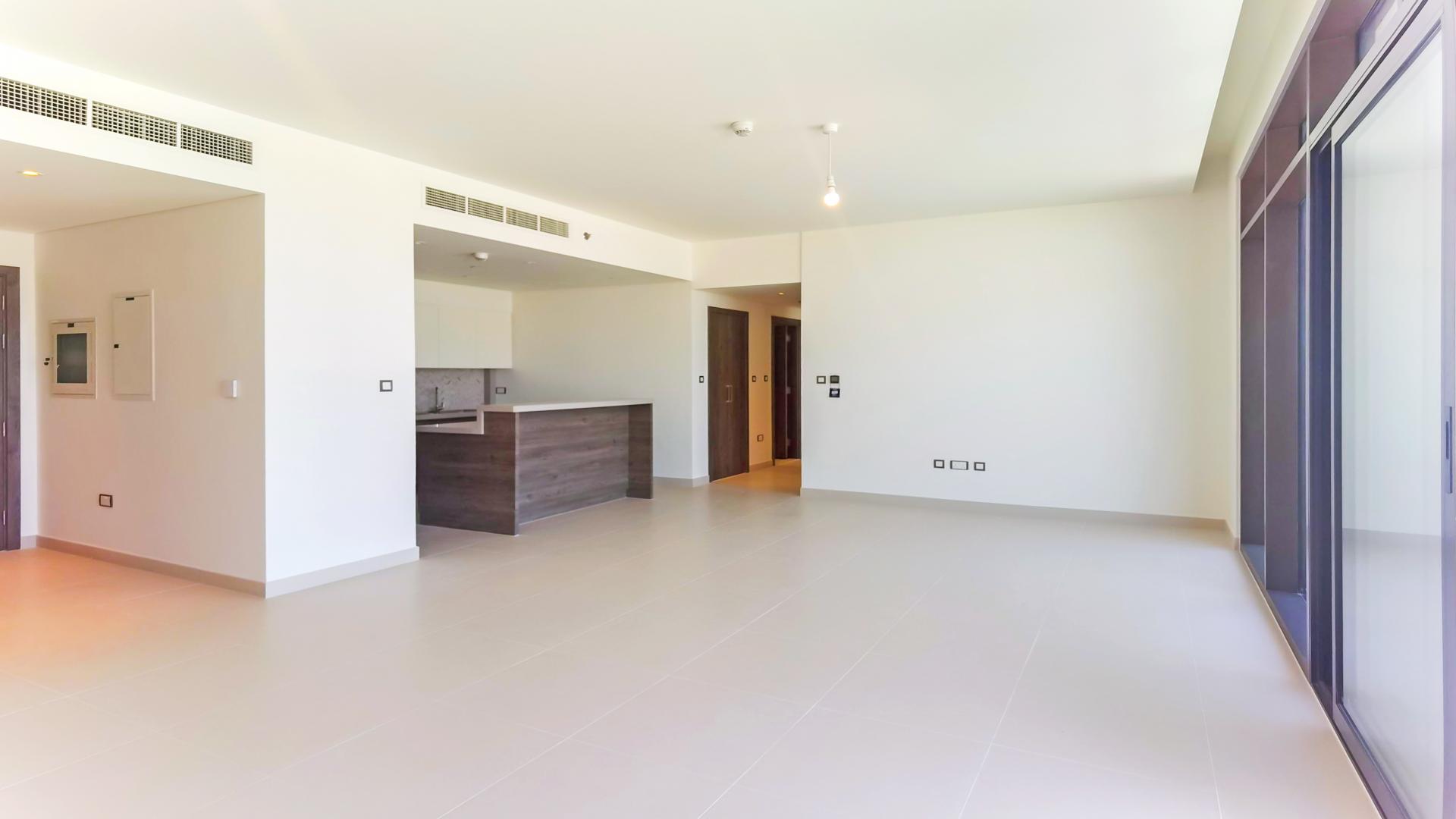 Balcony view from 3-bedroom apartment in The Cove, Dubai Creek Harbour, overlooking pool and skyline