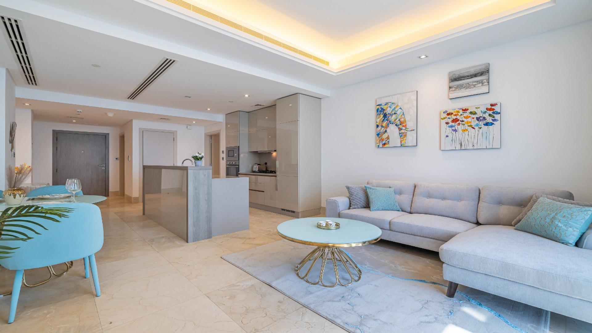 Modern Palm Jumeirah apartment living room with sea views, stylish decor, and natural light