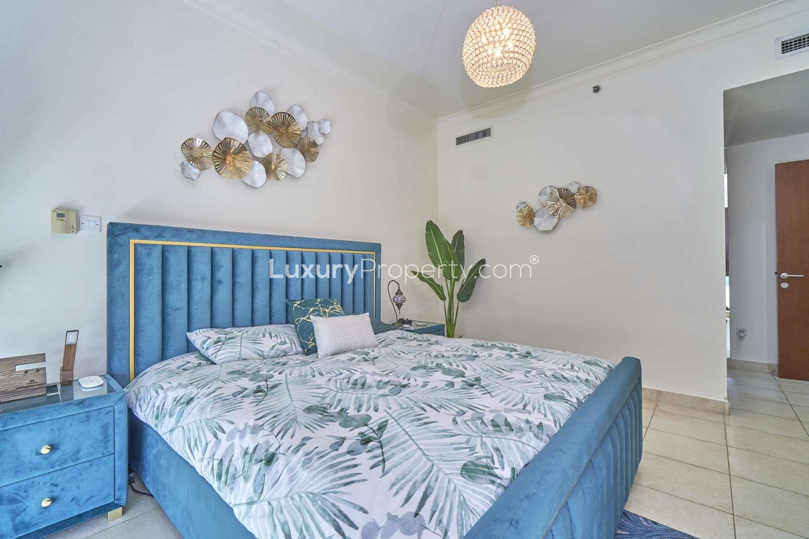 Luxurious living room with modern decor and panoramic views in The Fairways apartment