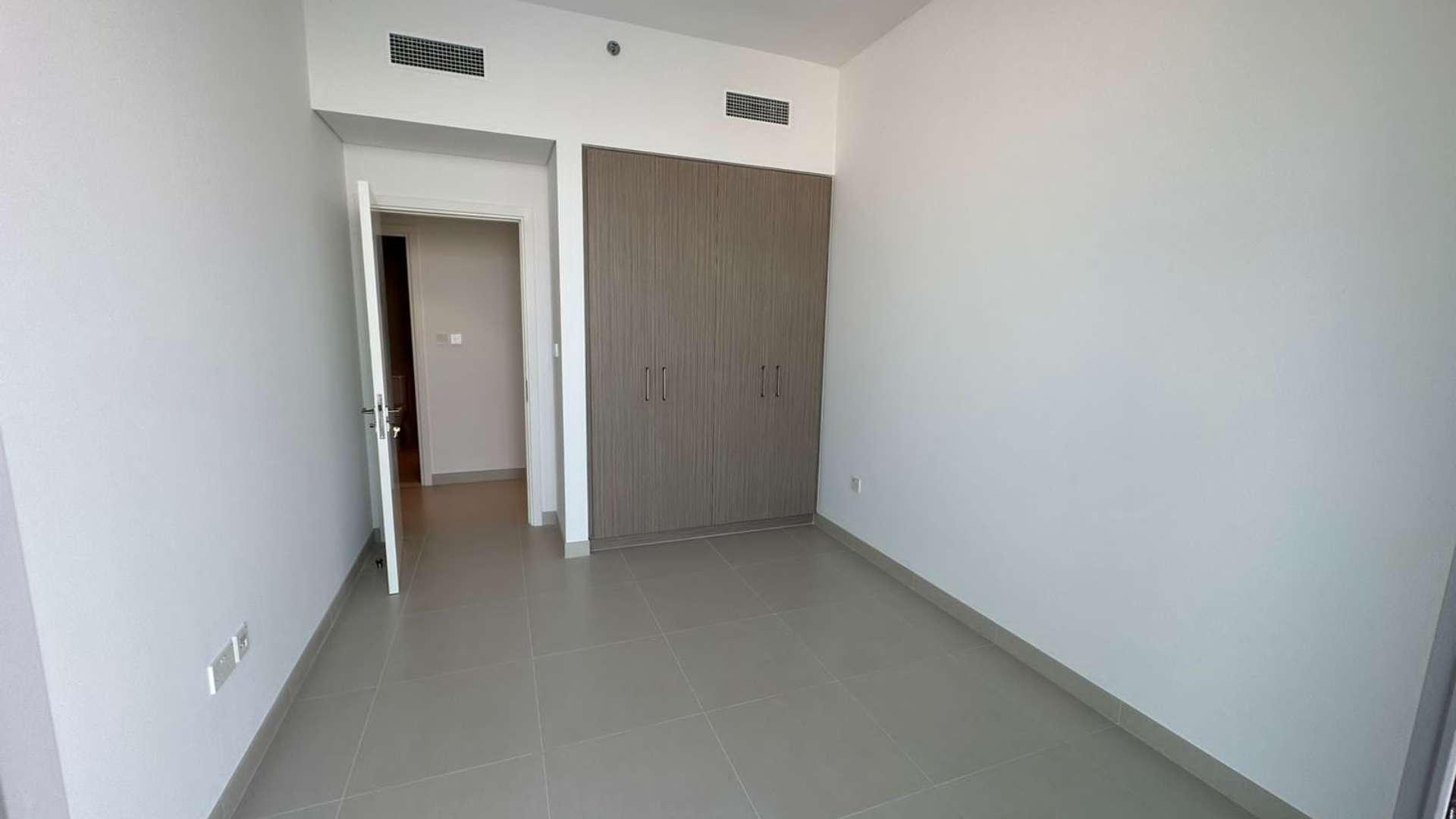 Bright, spacious living room with large windows in The Grand apartment, Dubai Creek Harbour