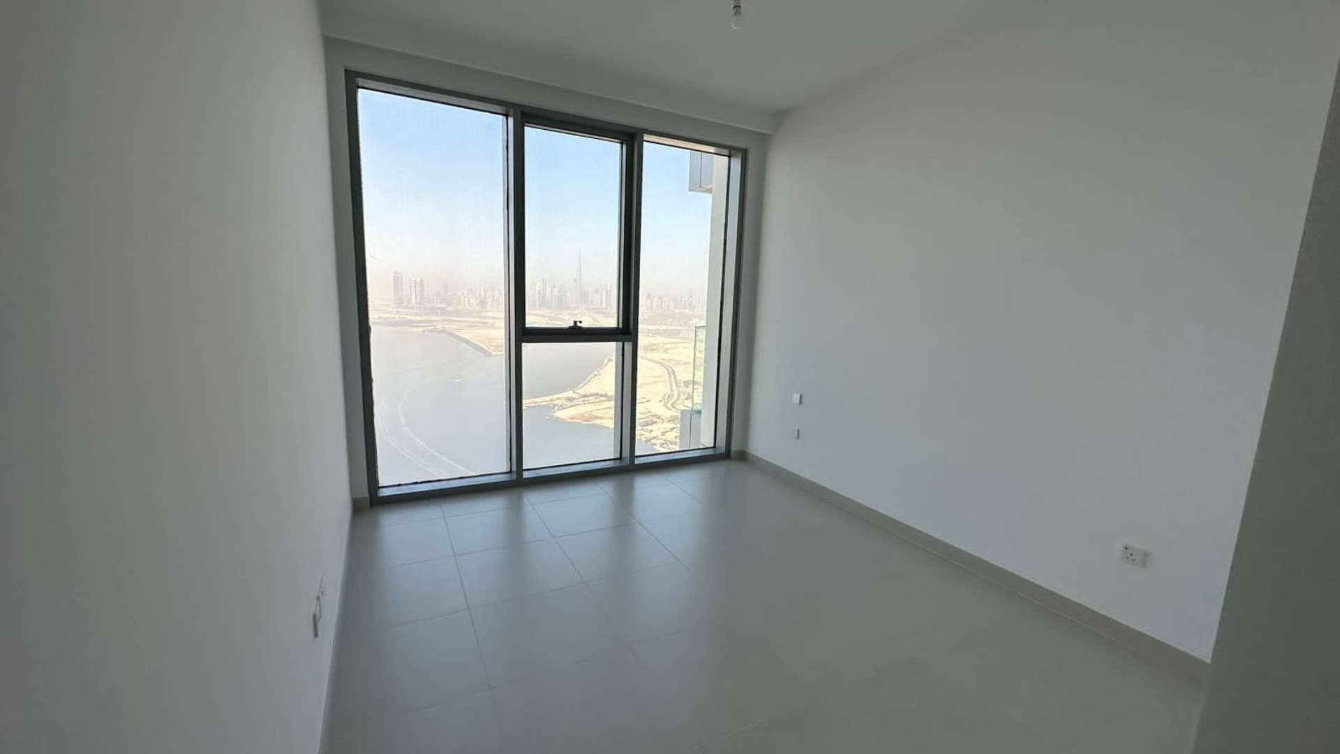 Empty bedroom with built-in closet in The Grand, Creek Harbour apartment for rent