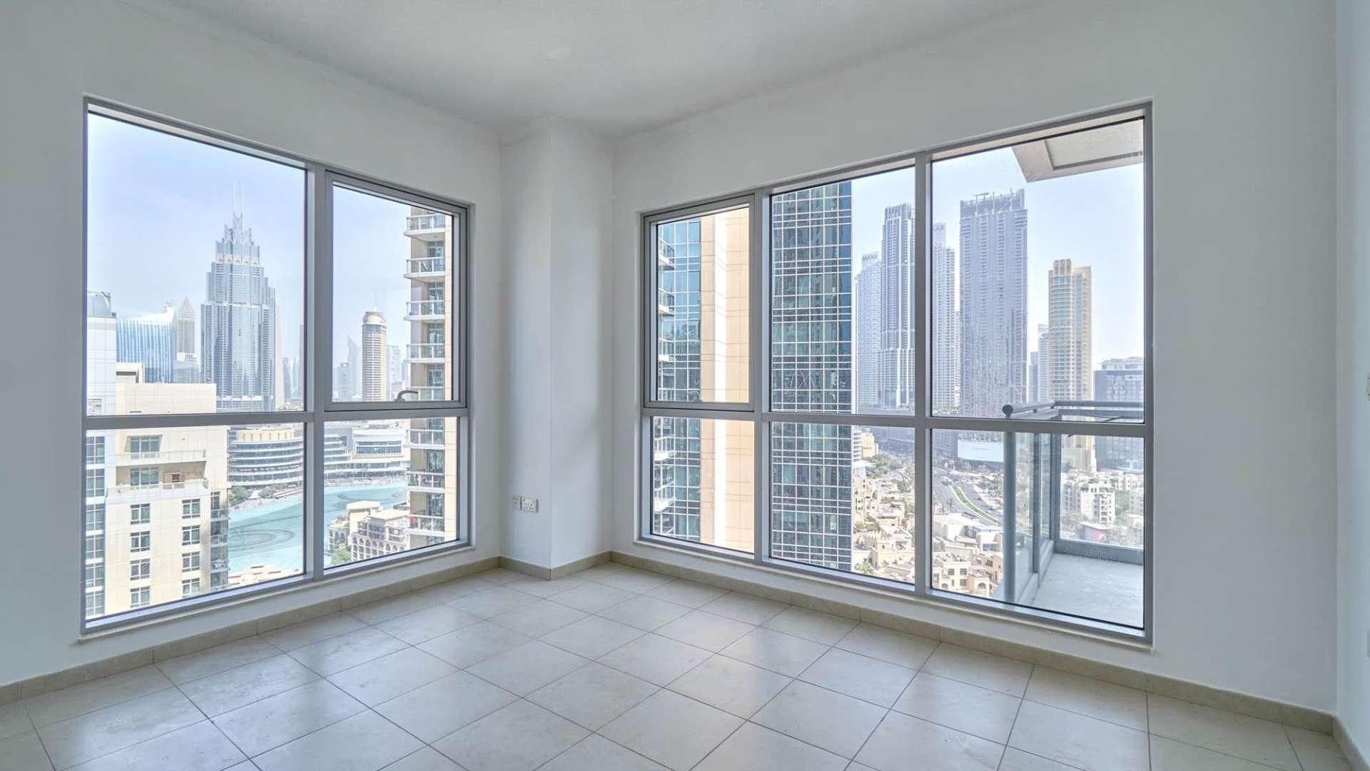 Bright Downtown Dubai apartment interior with balcony and Burj Khalifa view, The Residences