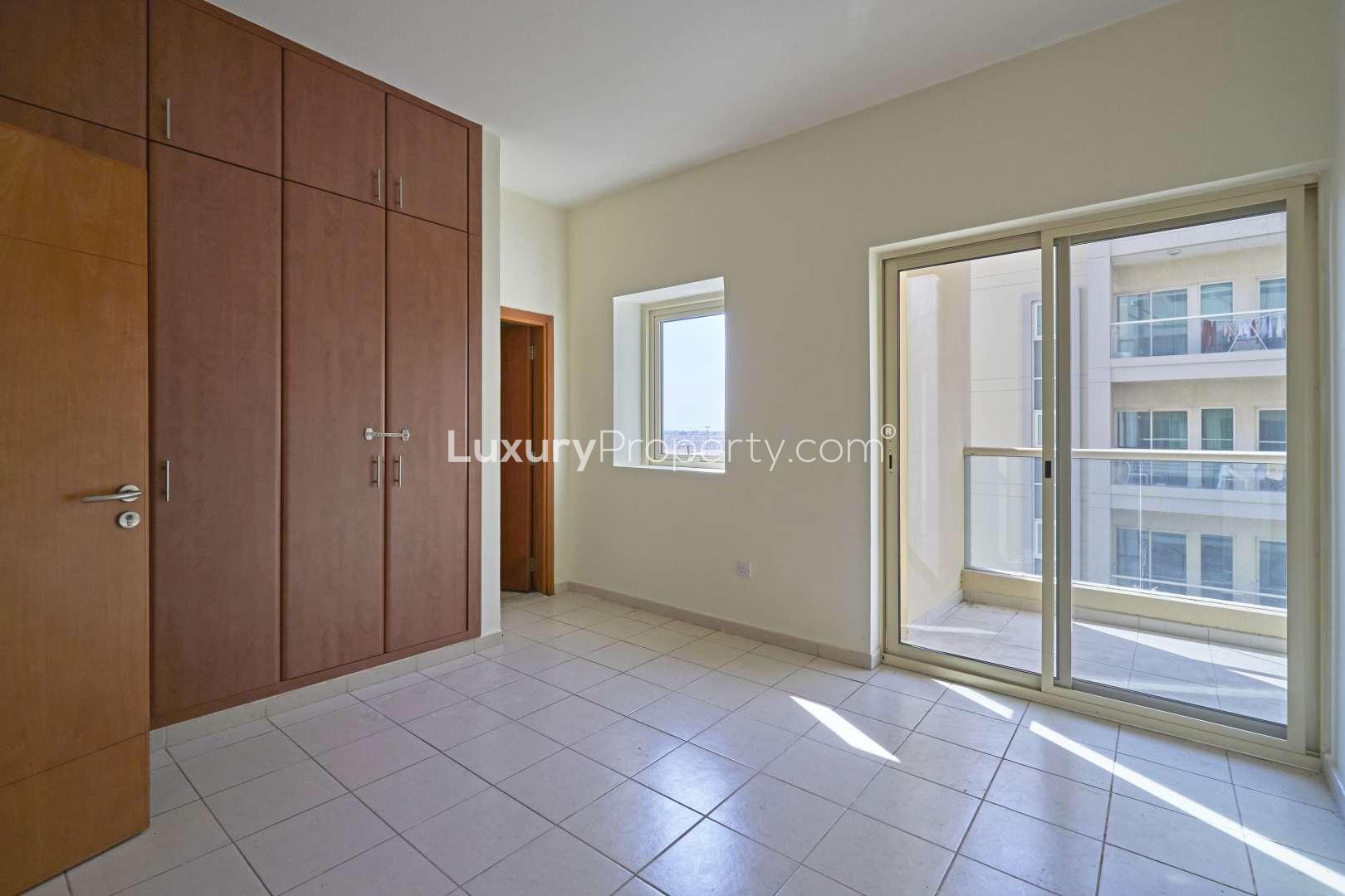 Lush green park with palm trees in The Views 2 community, near spacious apartment