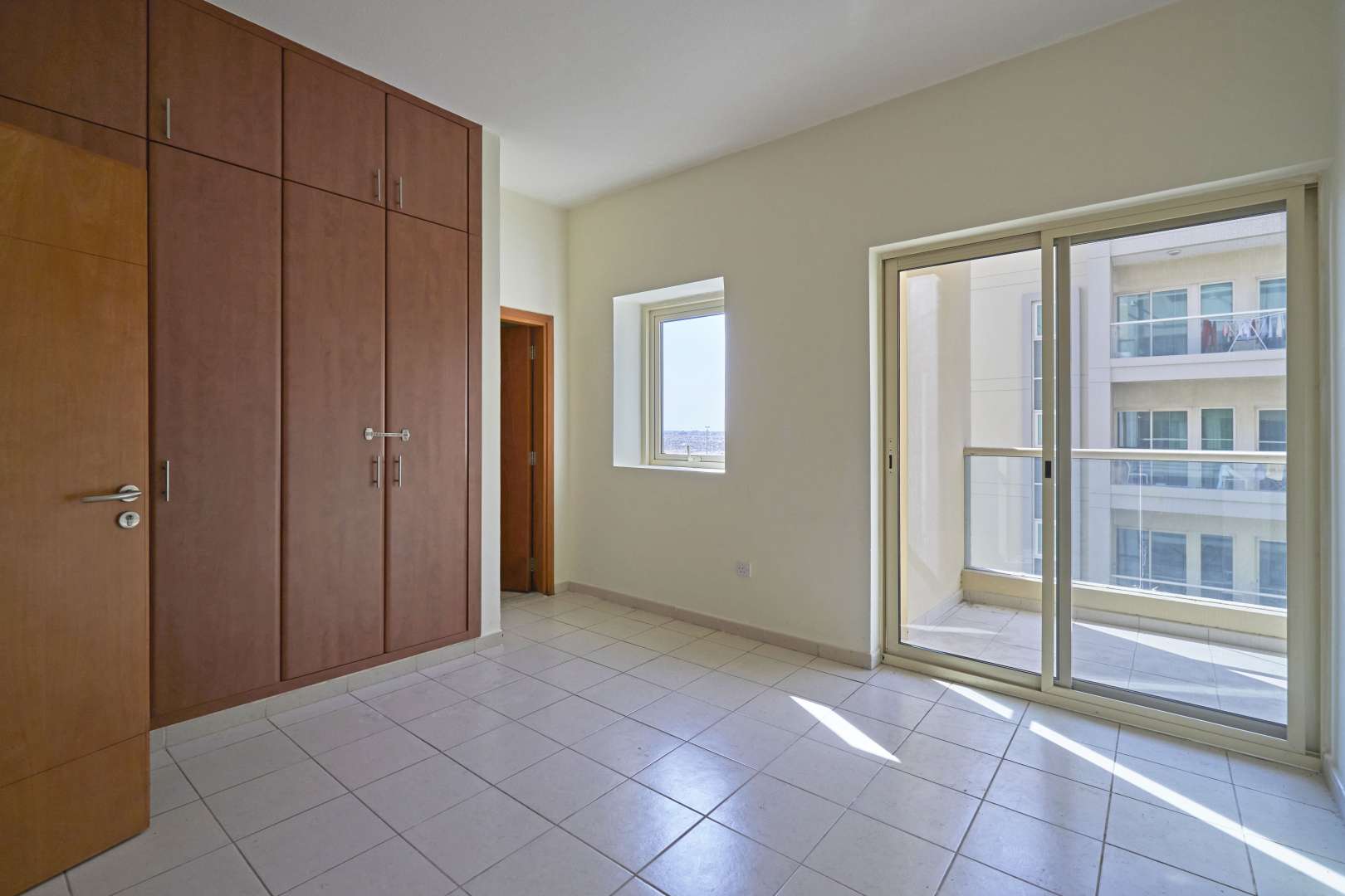 Lush green park with palm trees in The Views 2 community, near spacious apartment