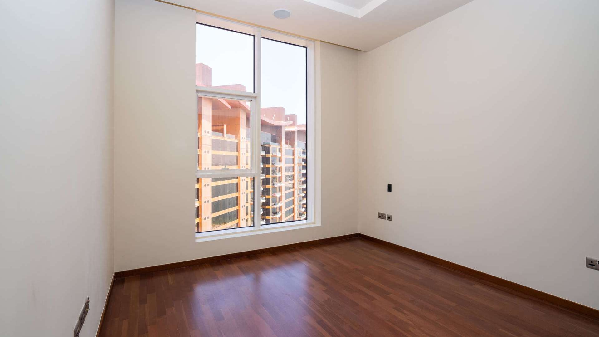 Aerial view of Sapphire Tower, Tiara Residences, Palm Jumeirah, with marina and pool area