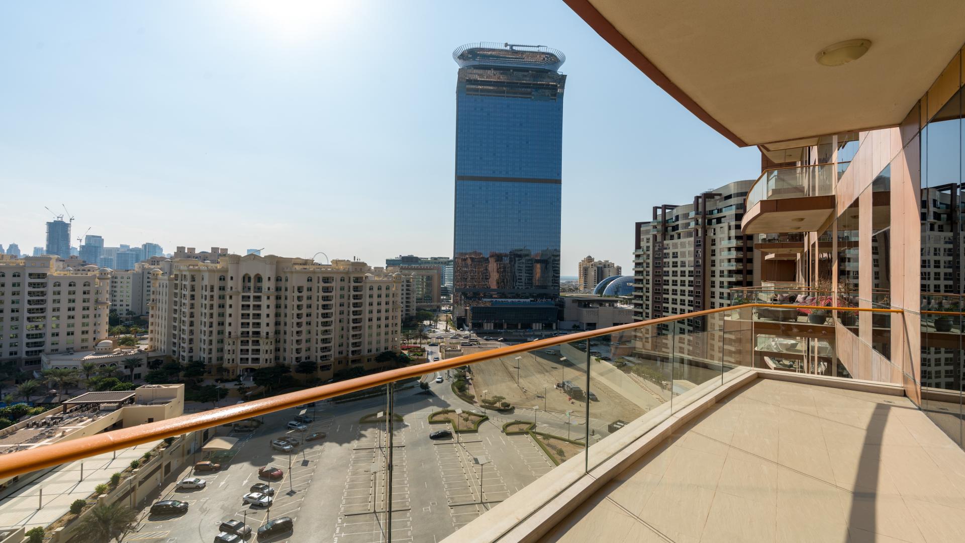 Vacant Palm Jumeirah apartment interior with large windows and stunning water views