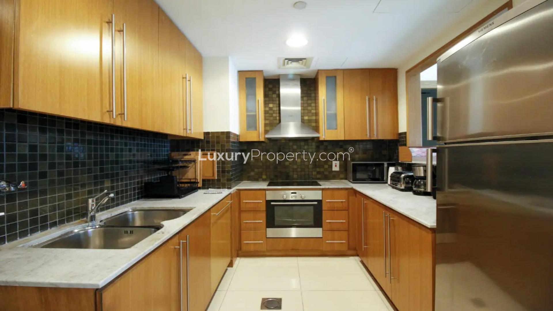 Balcony view of Dubai Marina from Iris Blue apartment with outdoor seating