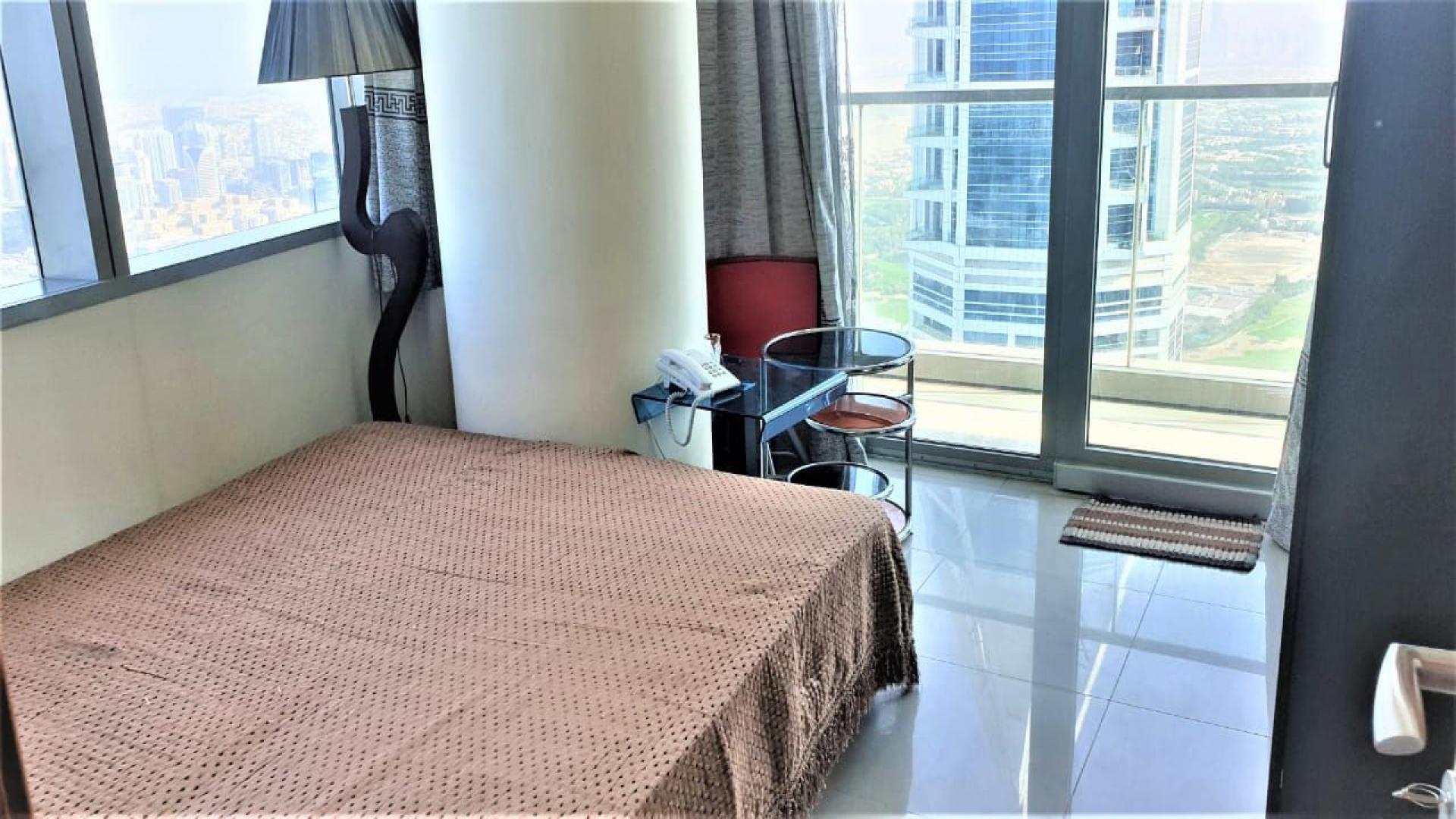 Modern kitchen with bar stools in 3-bedroom apartment, Ocean Heights, Dubai Marina