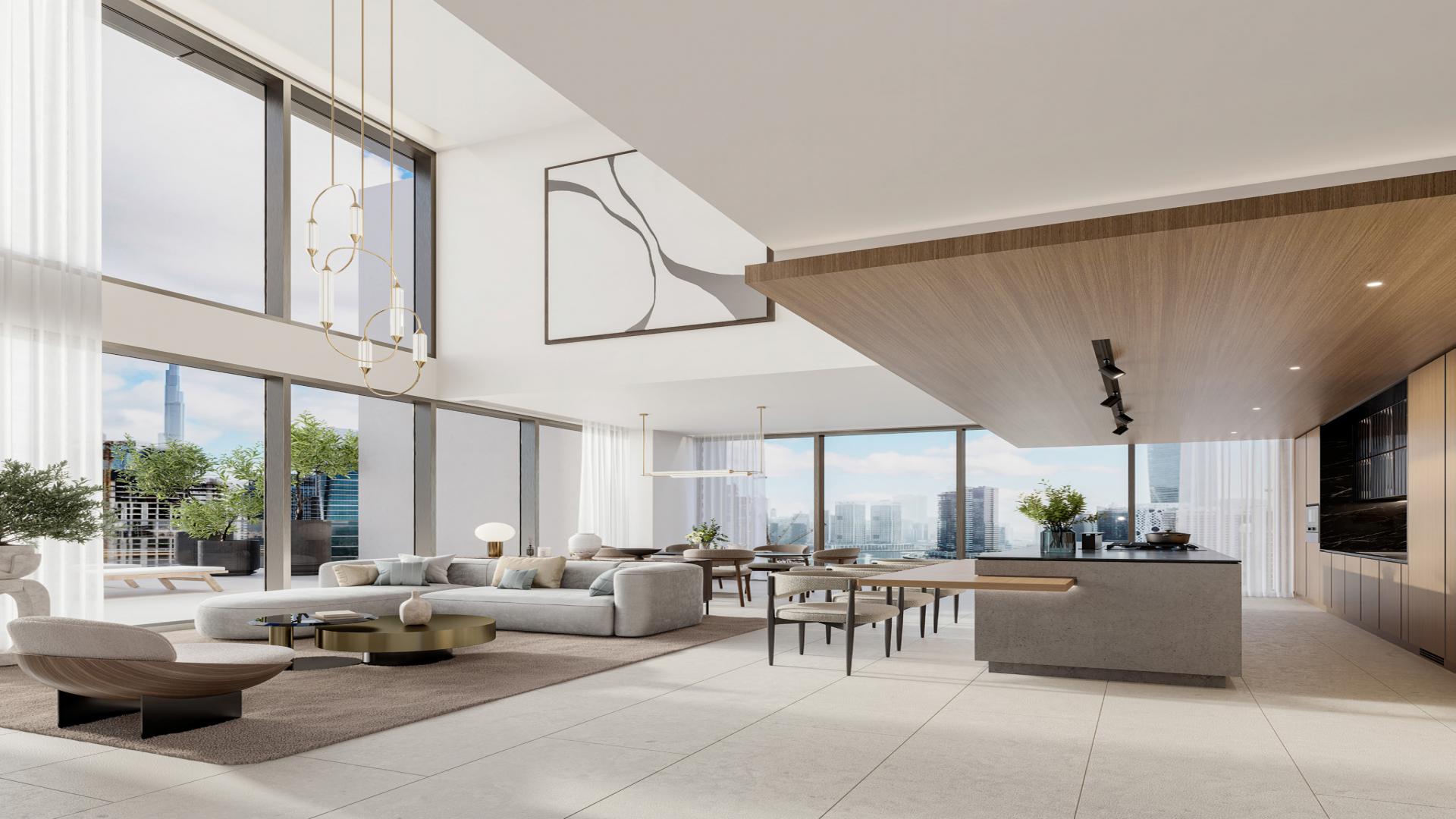 Tall luxury apartment building in Business Bay, One River Point, waterfront view at sunset