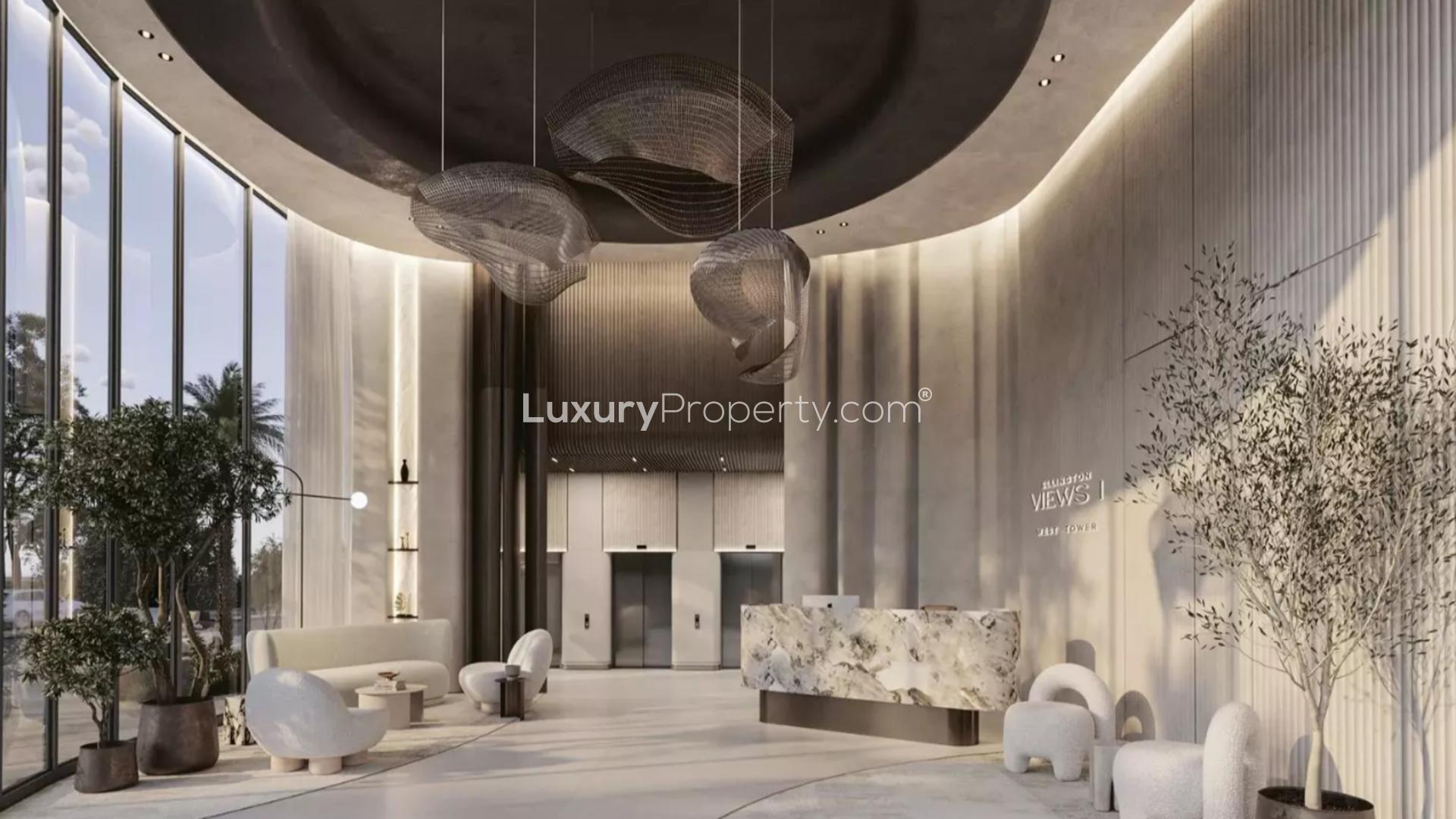 Modern open-plan kitchen and living room in Al Hamra Island apartment for sale