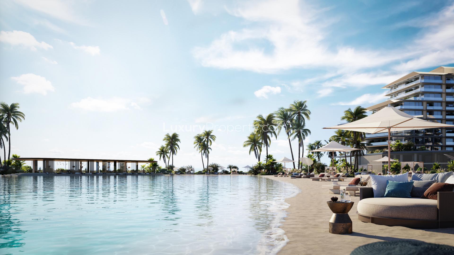 Oceanfront view from luxury apartment in Rixos, Dubai Islands, featuring palm trees and seating
