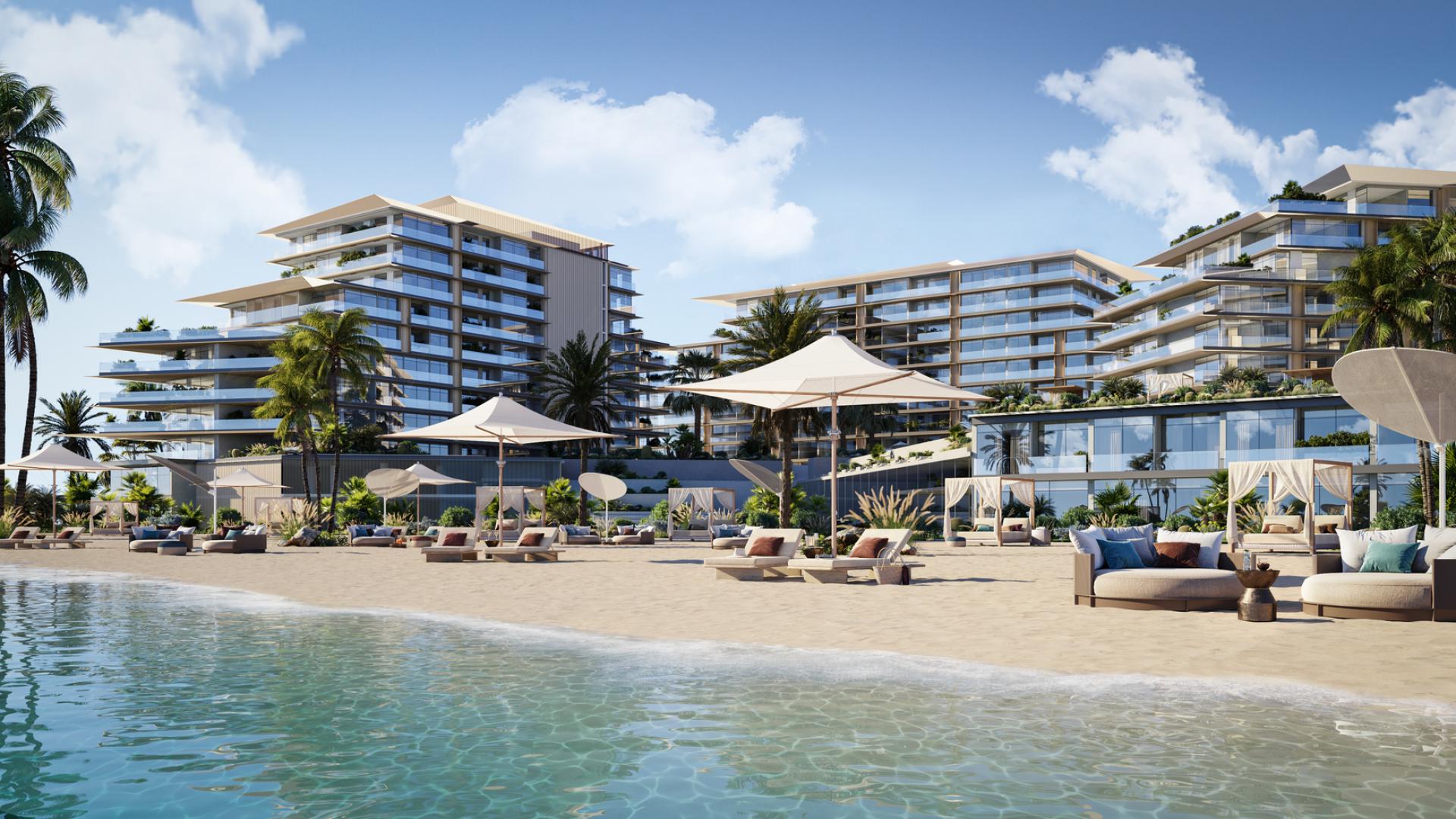 Luxurious beachfront apartment view in Rixos, Dubai Islands with palm trees and serene water