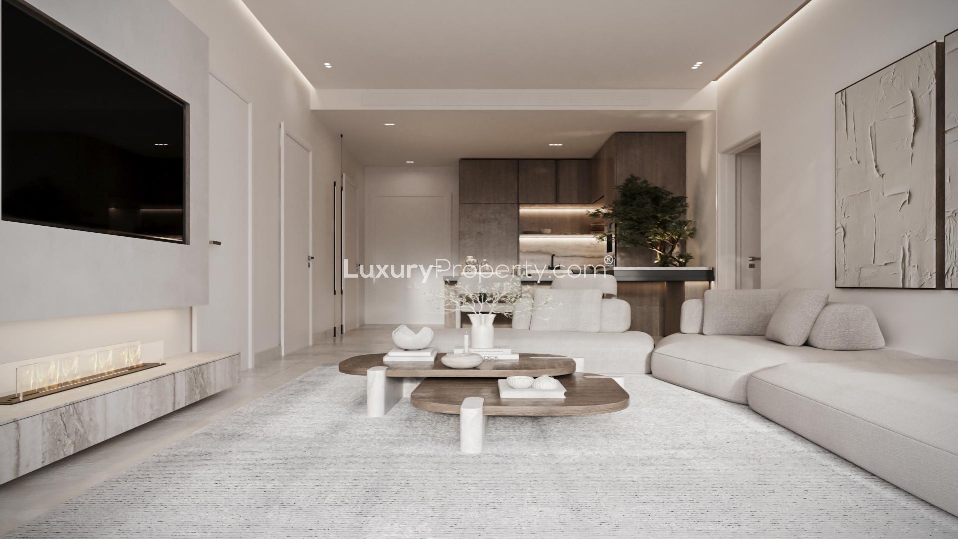 Modern living room in Jumeirah Village Circle apartment, featuring stylish decor and natural light