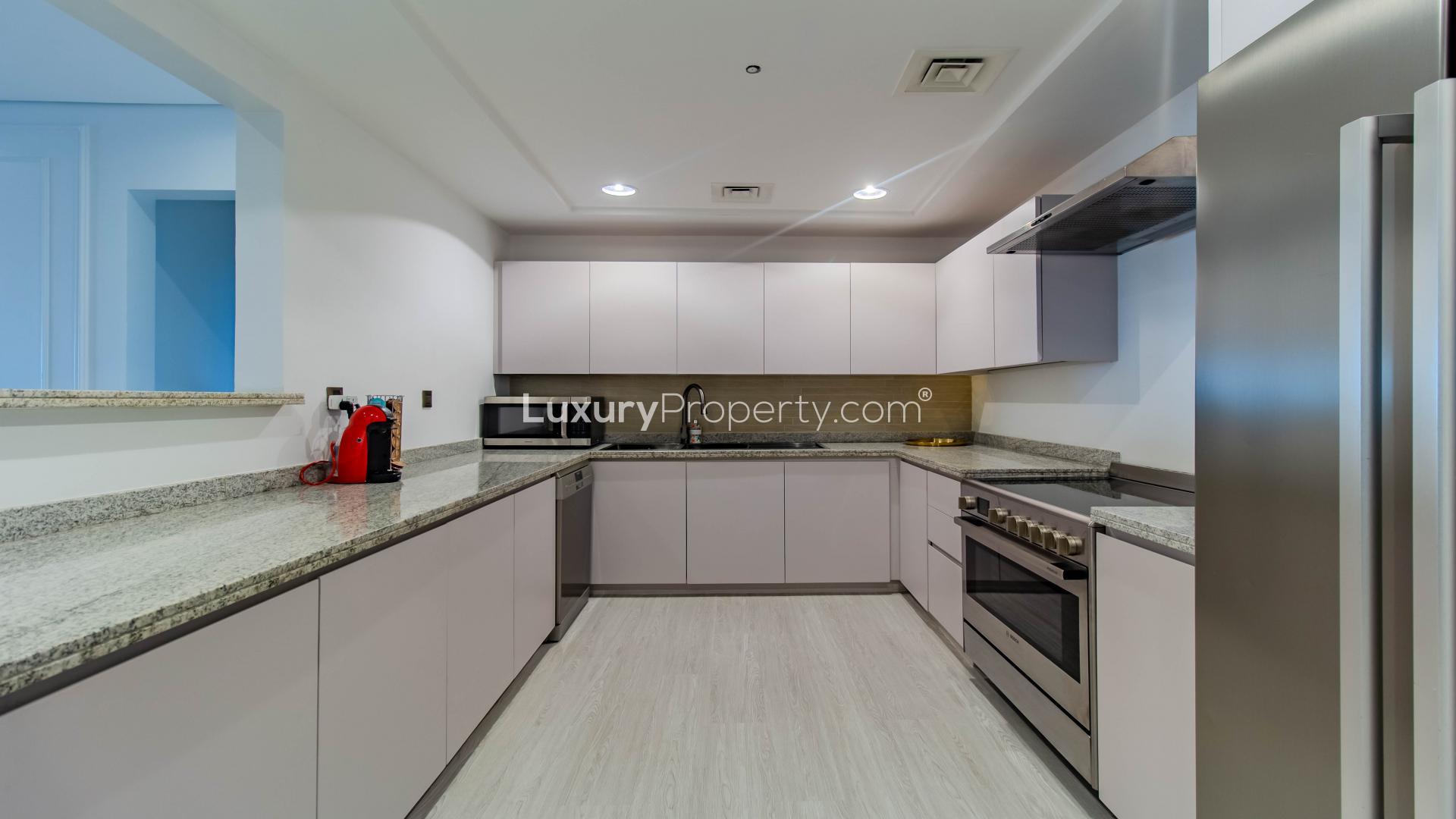 Modern dining area in Palm Jumeirah apartment, featuring elegant decor and contemporary lighting