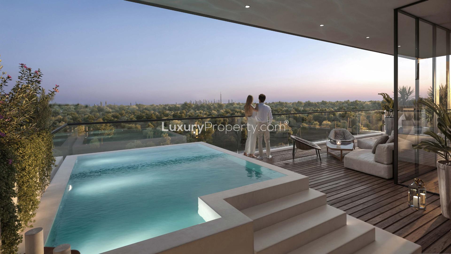 "Luxury Serra apartment balcony with pool and stunning skyline view, Ghaf Woods community.",Modern open-plan living area in Serra 3-bedroom apartment, Ghaf Woods, for sale