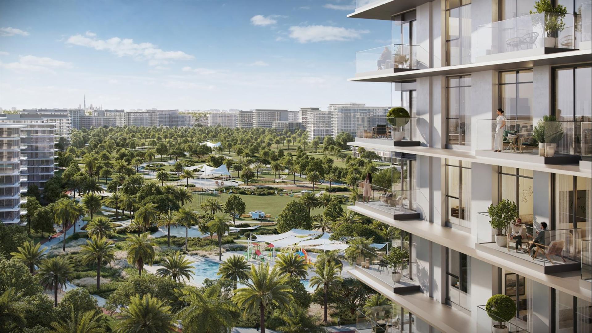 Modern entrance of Address Residences at Dubai Hills Estate with luxury car and palm trees