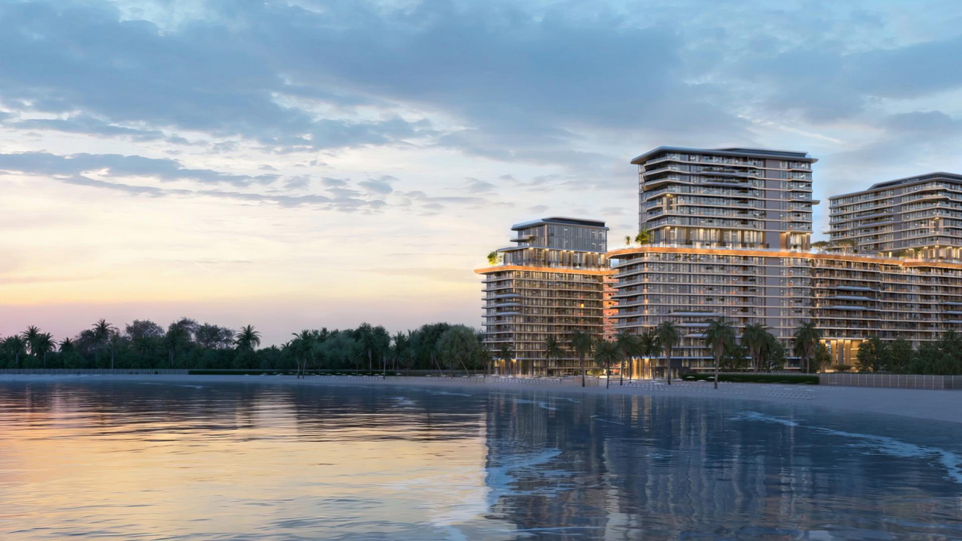 Luxurious Costa Mare apartment buildings with ocean view at sunset, Al Marjan Island