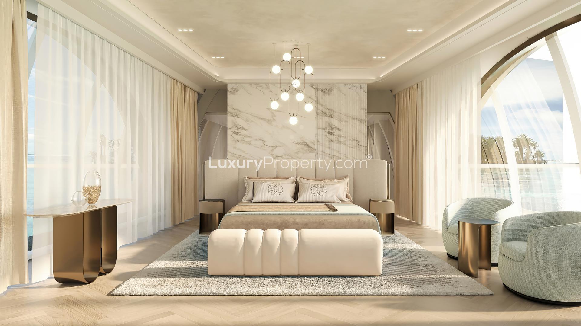 Luxurious living room in Maldives water villa with modern decor, overlooking private pool