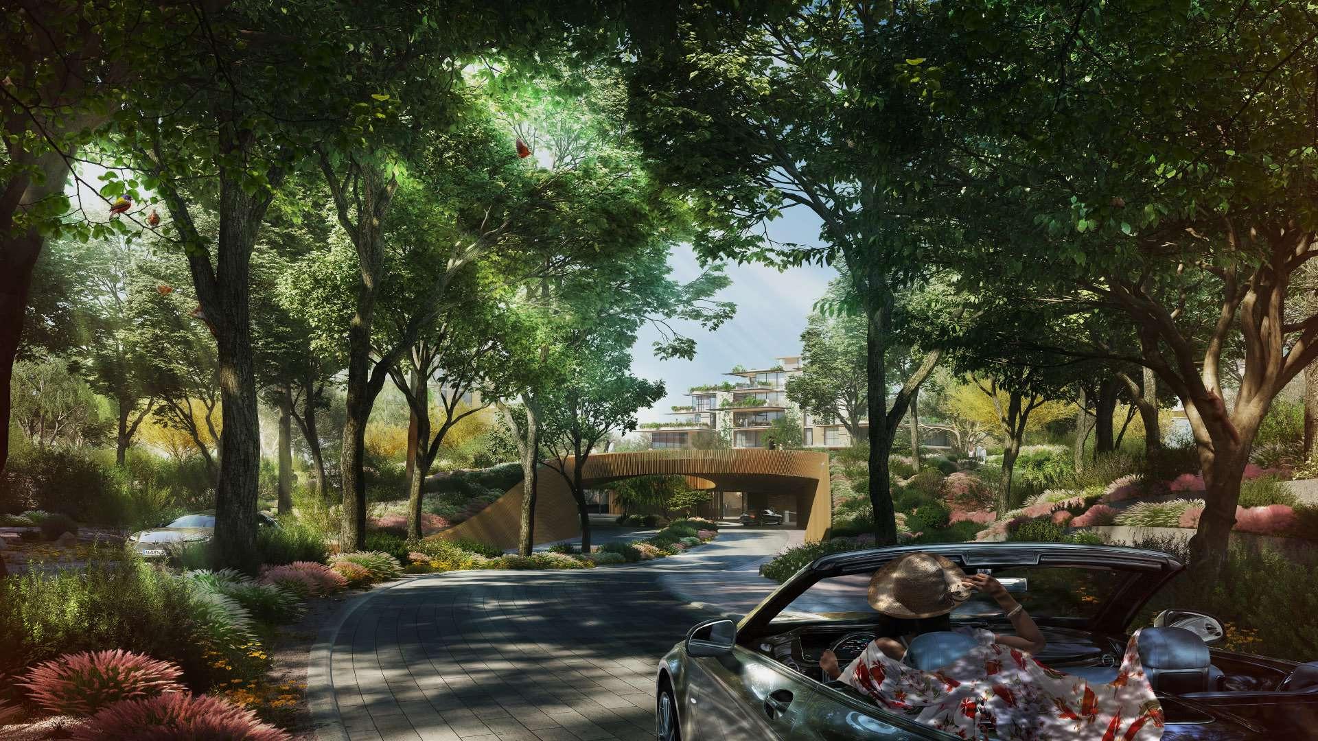 "Luxury Capria apartment exterior with forest view and pool in Ghaf Woods community.",Luxury forest-facing apartment entrance at Capria, Ghaf Woods; lush greenery and driveway view
