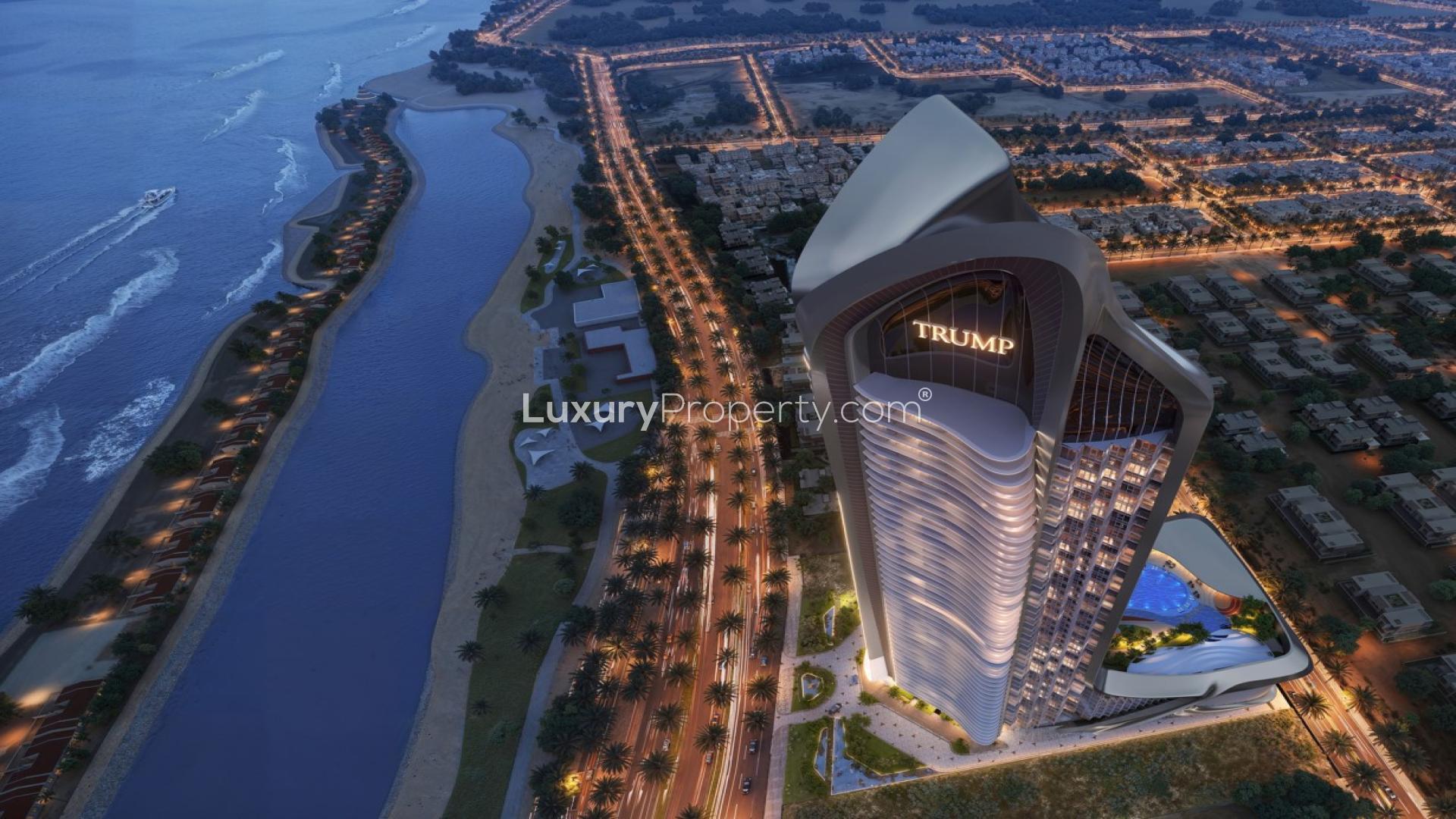 "Stunning ocean view from Trump Tower Jeddah apartment balcony at sunset, LP44466.",Aerial view of Trump Tower Jeddah at night, highlighting luxury apartments and stunning coastline