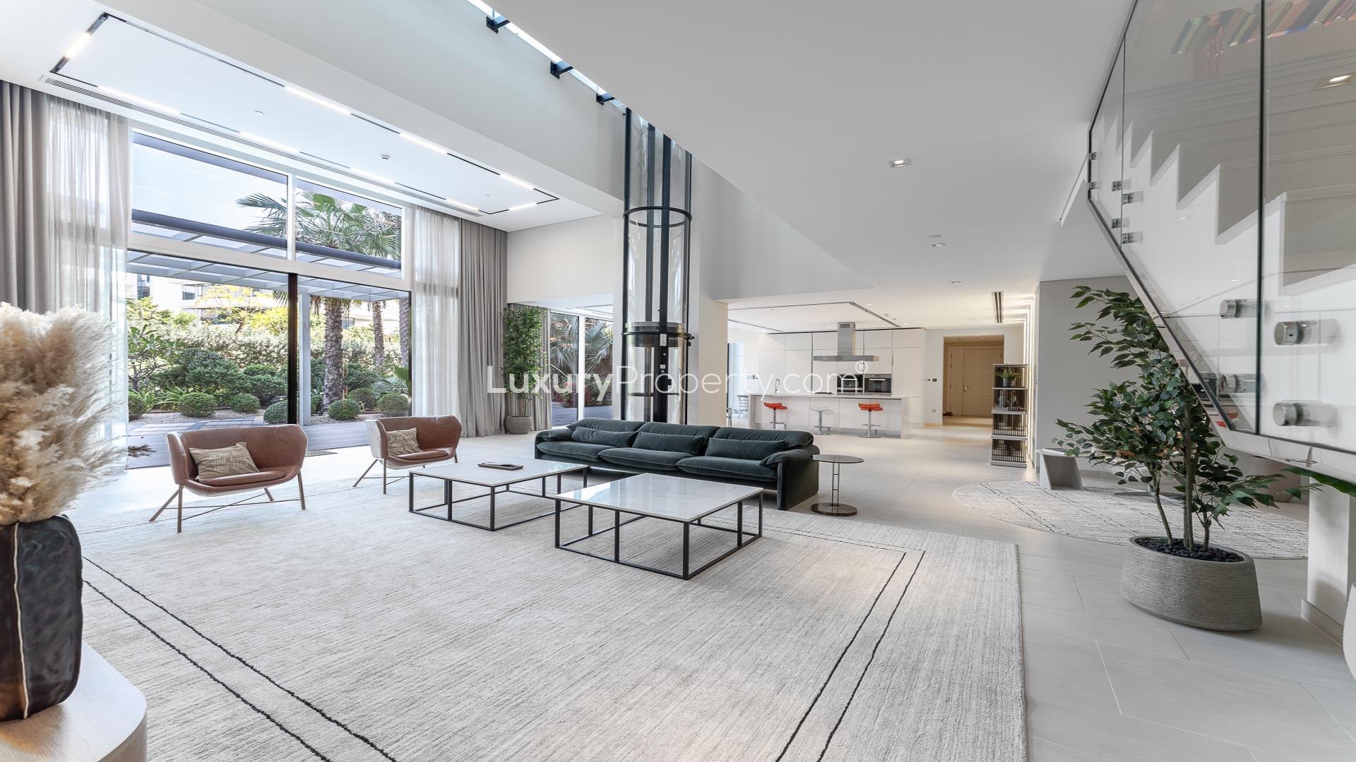 Luxurious living room in Seventh Heaven duplex, Al Barari, with modern decor and elevator